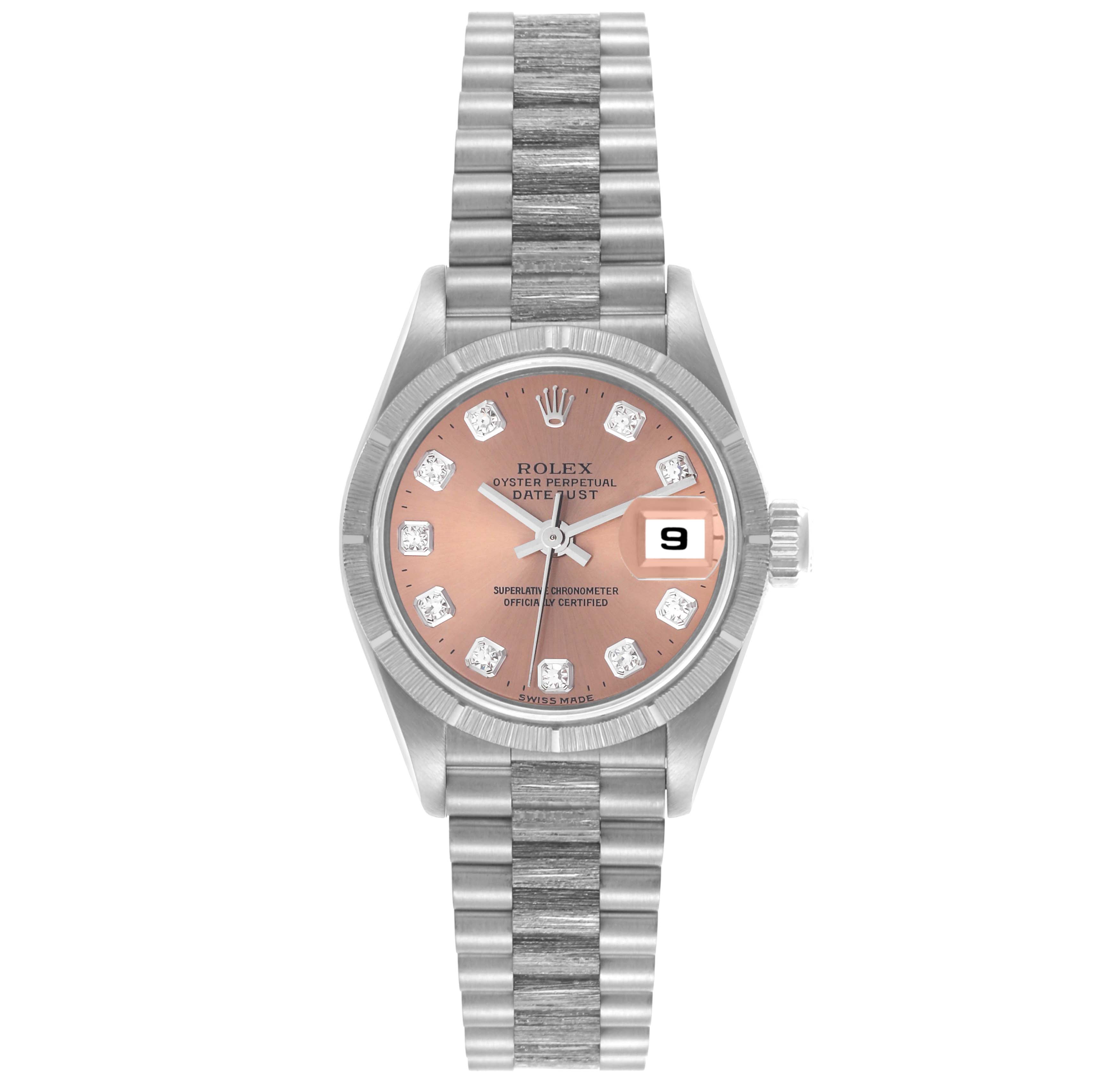 The Rolex President 69278 Women's White Gold Pink Dial 69278 Women's White Gold Pink Dial model watch is shown from a top view, featuring its full bracelet and face with diamond hour markers.
