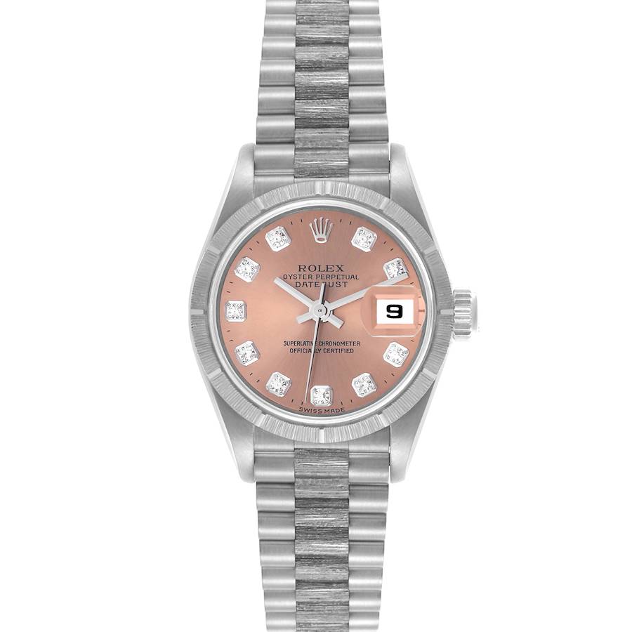 The Rolex President model is shown from the front, displaying the dial, fluted bezel, bracelet, and date window.