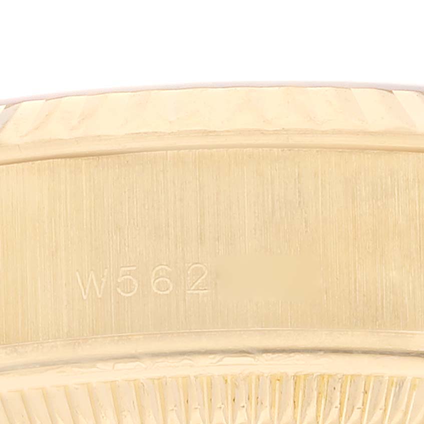 This is a close-up of the side of the Rolex President 69178 Women
s Yellow Gold Champagne Dial 69178 Women
s Yellow Gold Champagne Dial model watch, showcasing its engraved serial number.