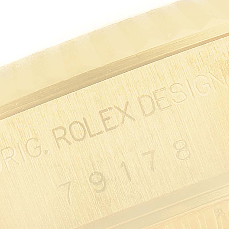 The image shows a close-up of the engraved side of the case of a Rolex President 79178 Women
s Yellow Gold Champagne Dial 79178 Women
s Yellow Gold Champagne Dial model watch.