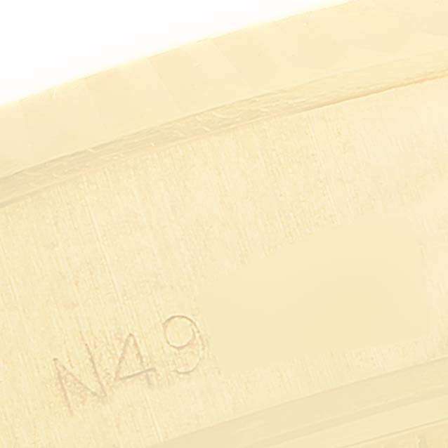 The image shows a close-up of the engraving on the case of a Rolex President 69178 Women
s Yellow Gold Champagne Dial 69178 Women
s Yellow Gold Champagne Dial model watch.