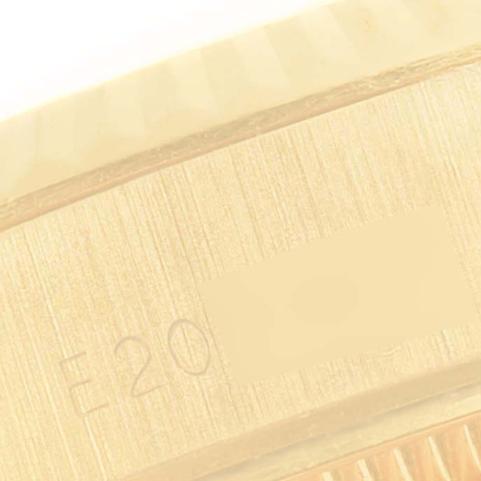 This close-up image shows the side of a Rolex President 69178 Women
s Yellow Gold Champagne Dial 69178 Women
s Yellow Gold Champagne Dial model watch with part of its engraved serial number.