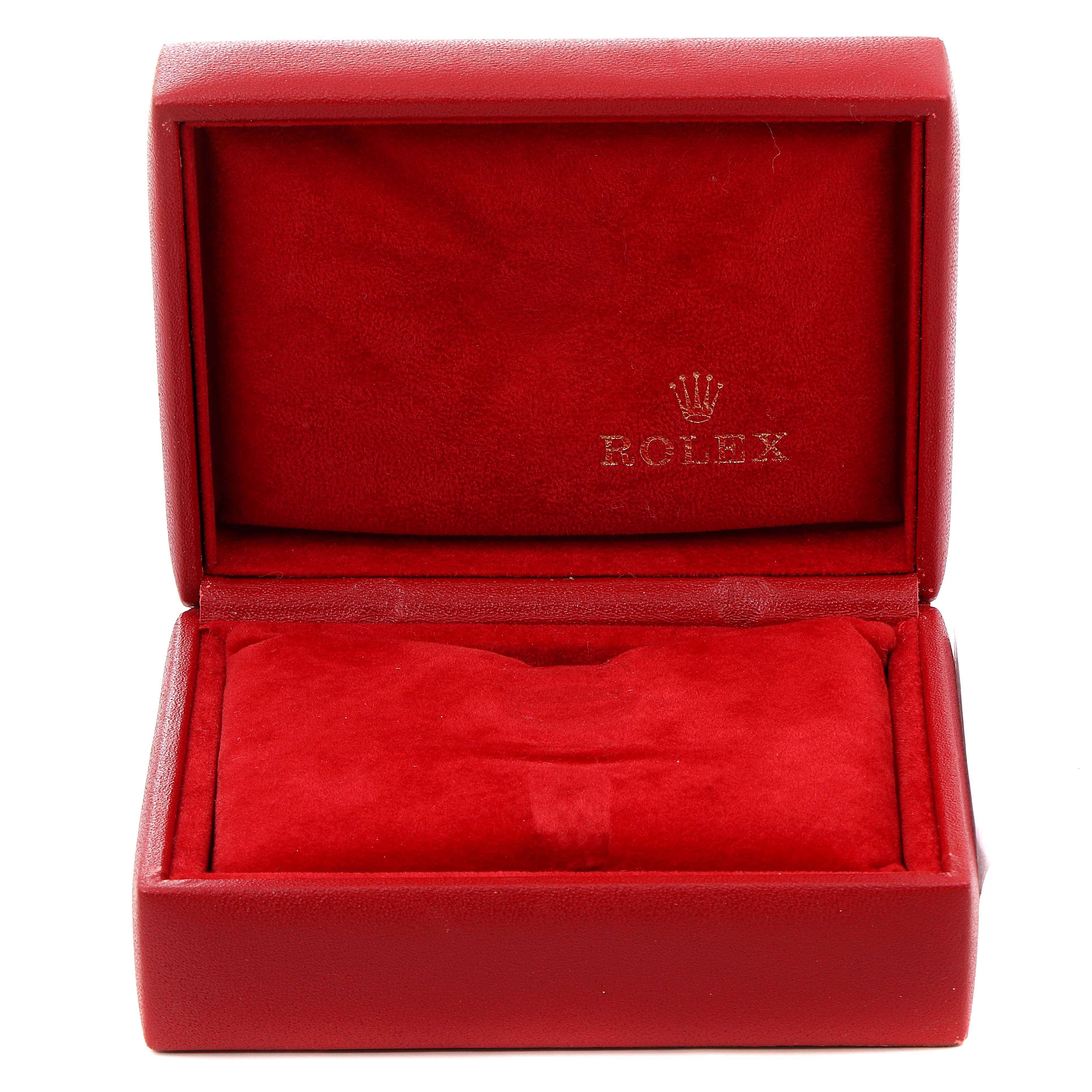 This image shows an open red Rolex watch box, typically used for the President model.
