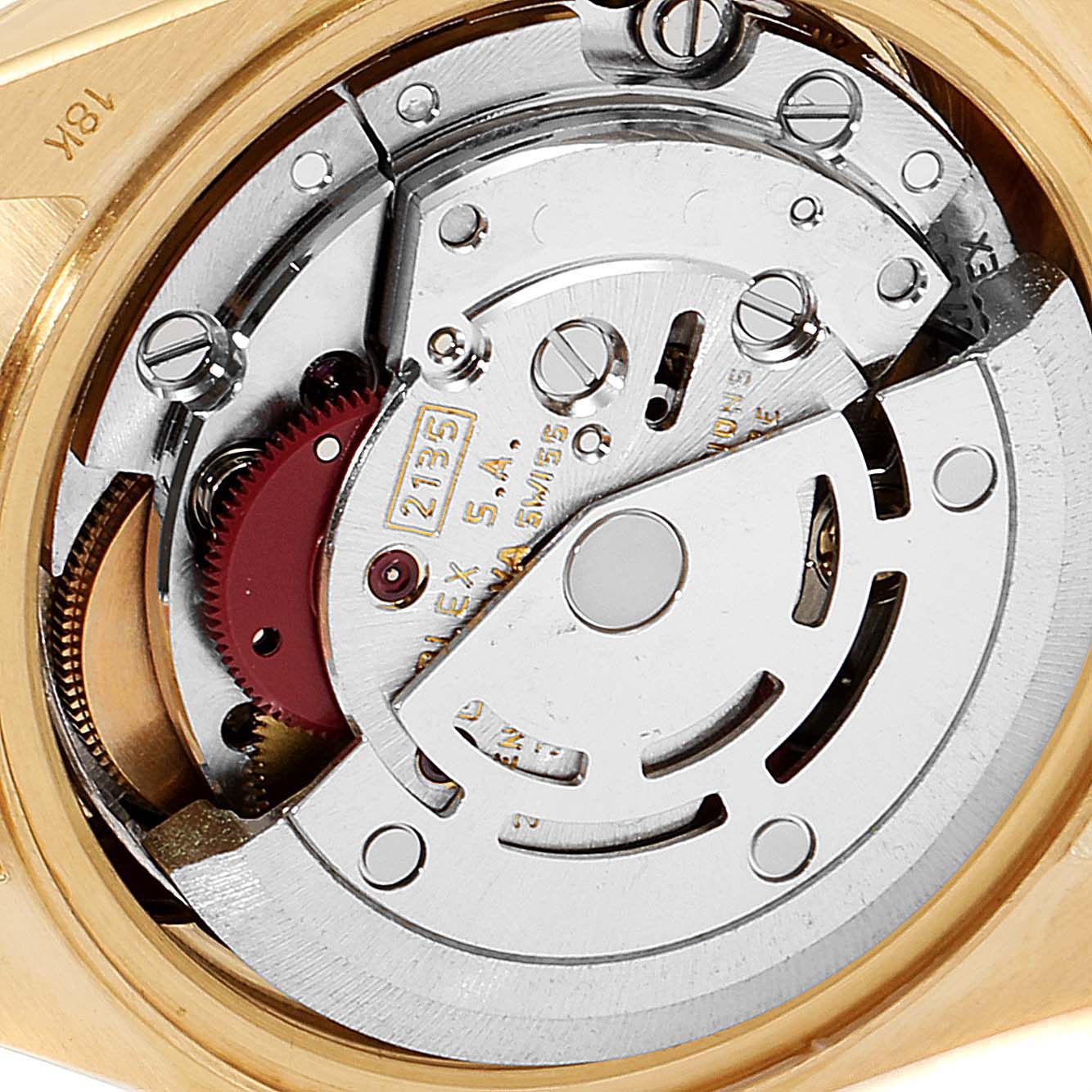 The image shows a close-up of the internal mechanism of a Rolex President 69178 Women
s Yellow Gold Champagne Dial 69178 Women
s Yellow Gold Champagne Dial watch, highlighting its movement and intricate parts.