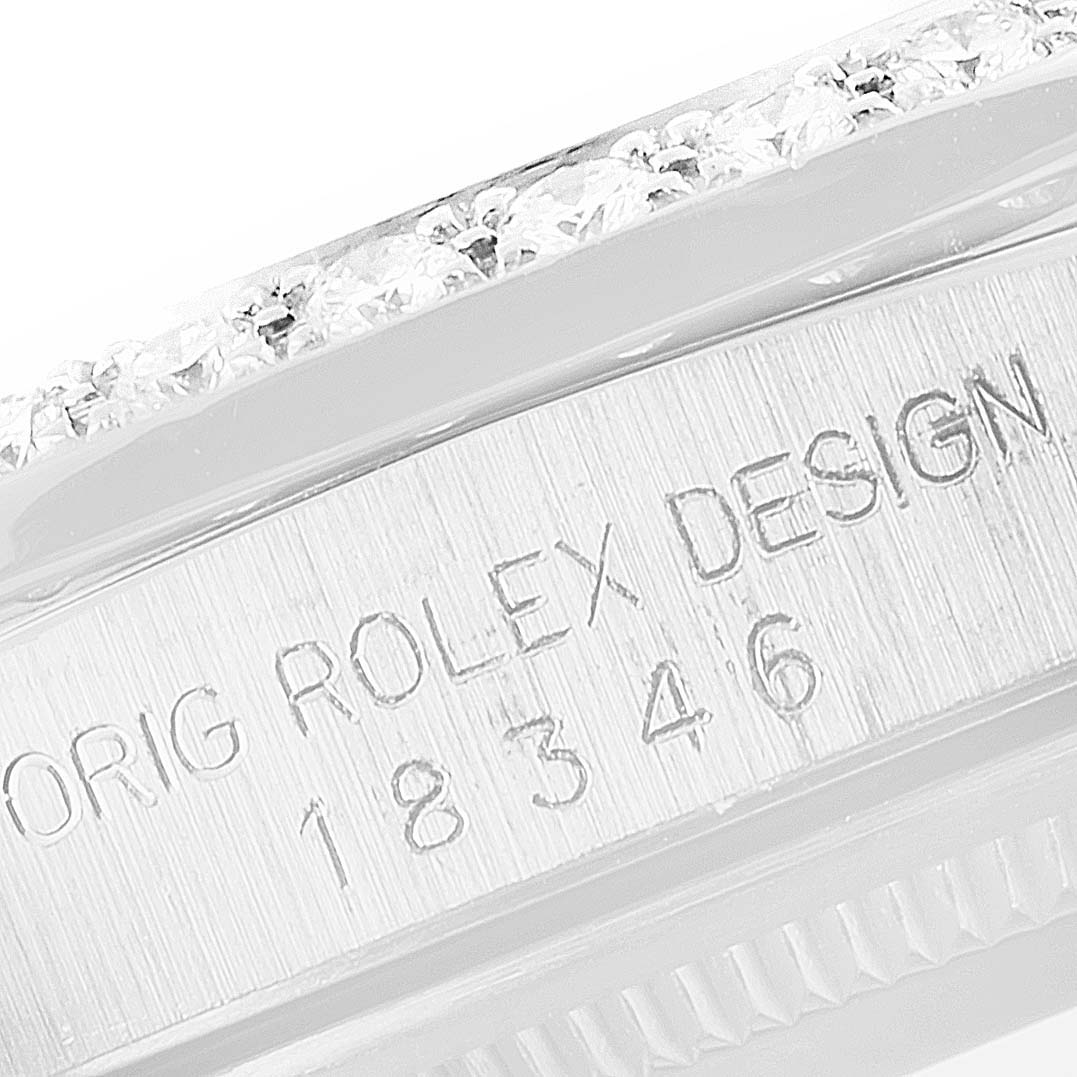 This close-up image shows the engraved case number and part of the bezel of a Rolex President 18346 Men's Platinum Silver Dial 18346 Men's Platinum Silver Dial model watch.