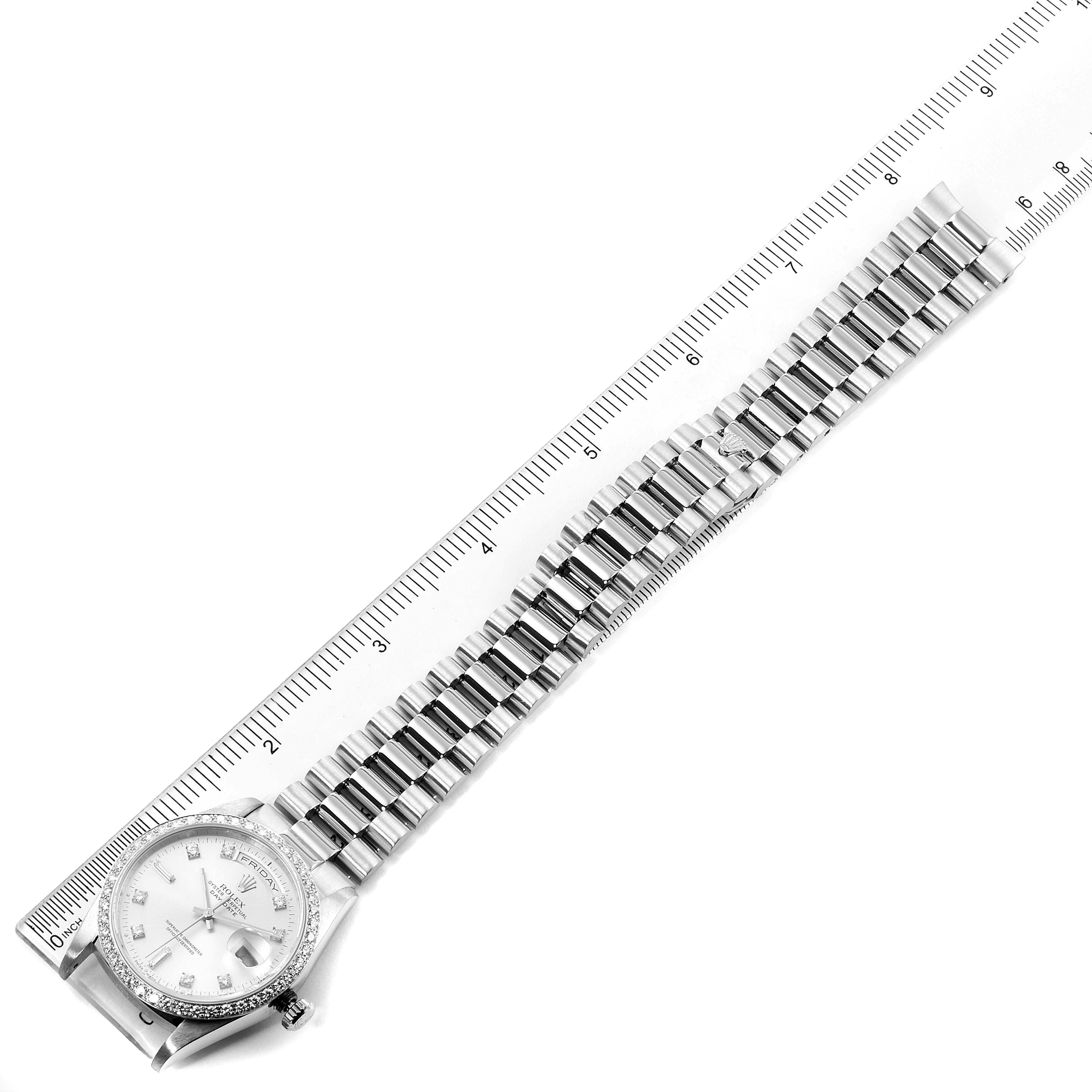 The Rolex President 18346 Men's Platinum Silver Dial 18346 Men's Platinum Silver Dial model watch is shown from an overhead angle, displaying its face, bezel, and entire bracelet along a ruler.