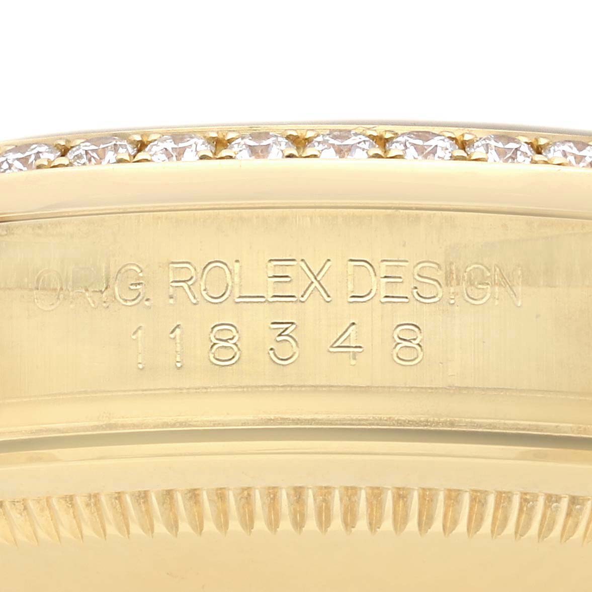 The image shows the side of the Rolex President 118348 Men
s Yellow Gold Champagne Dial 118348 Men
s Yellow Gold Champagne Dial watch case, highlighting the model number and diamond-set bezel.