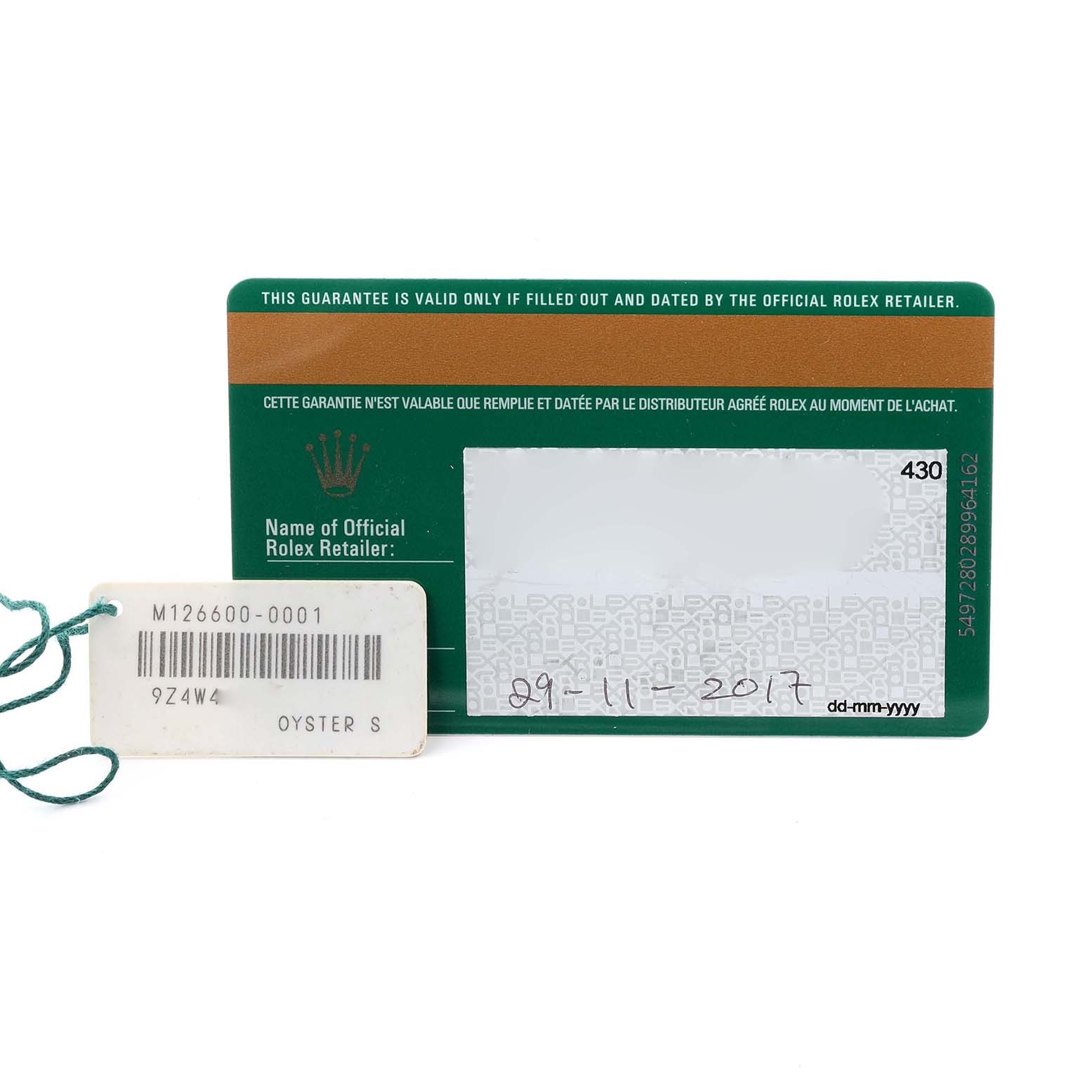 The image shows a warranty card and tag for the Rolex Sea-Dweller 126600 Men's Stainless Steel Black Dial 126600 Men's Stainless Steel Black Dial model, with date and model details visible.