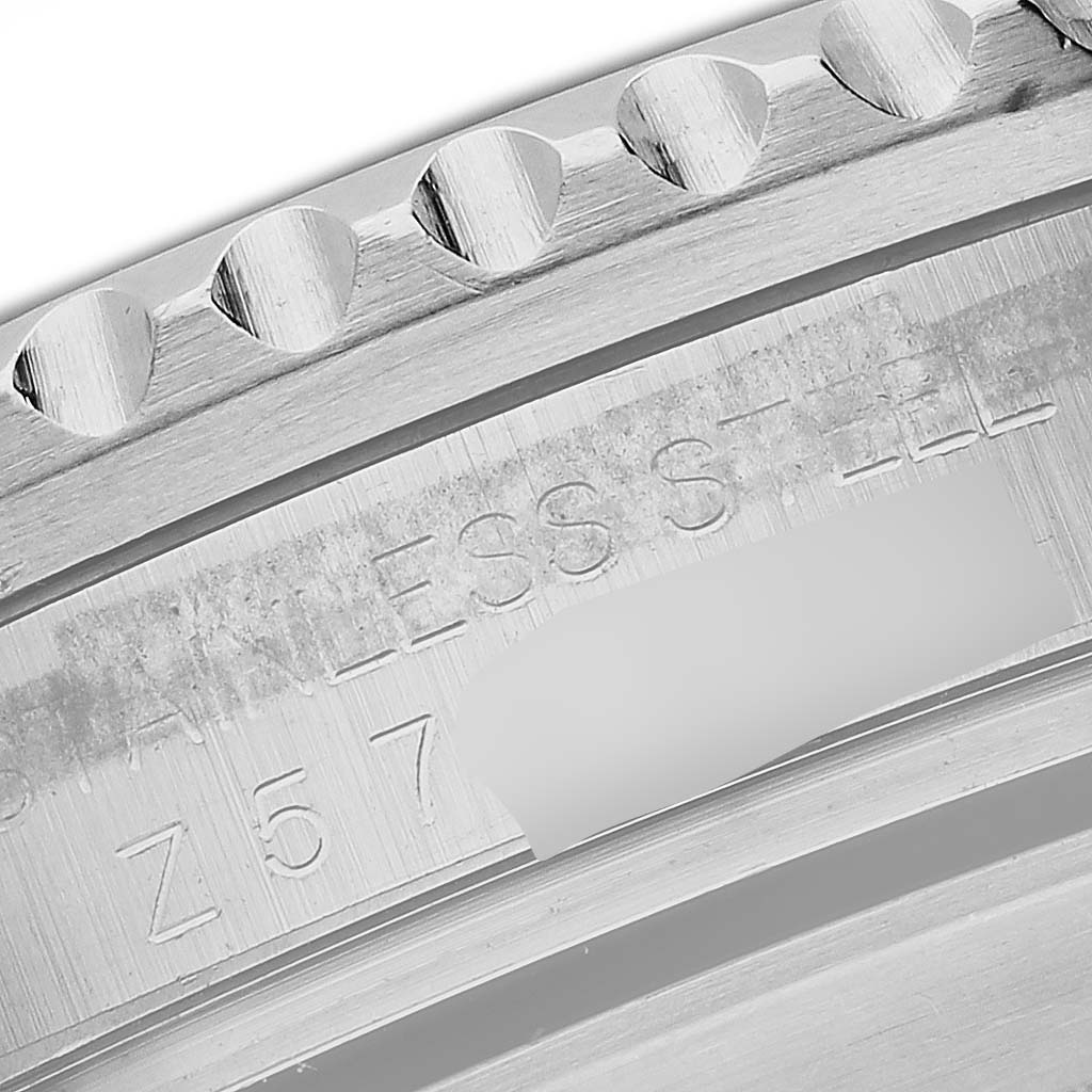 The image shows a close-up of the engraved bezel and case side of a Rolex Submariner 16610 Men
s Stainless Steel Black Dial 16610 Men
s Stainless Steel Black Dial, highlighting its stainless steel material.