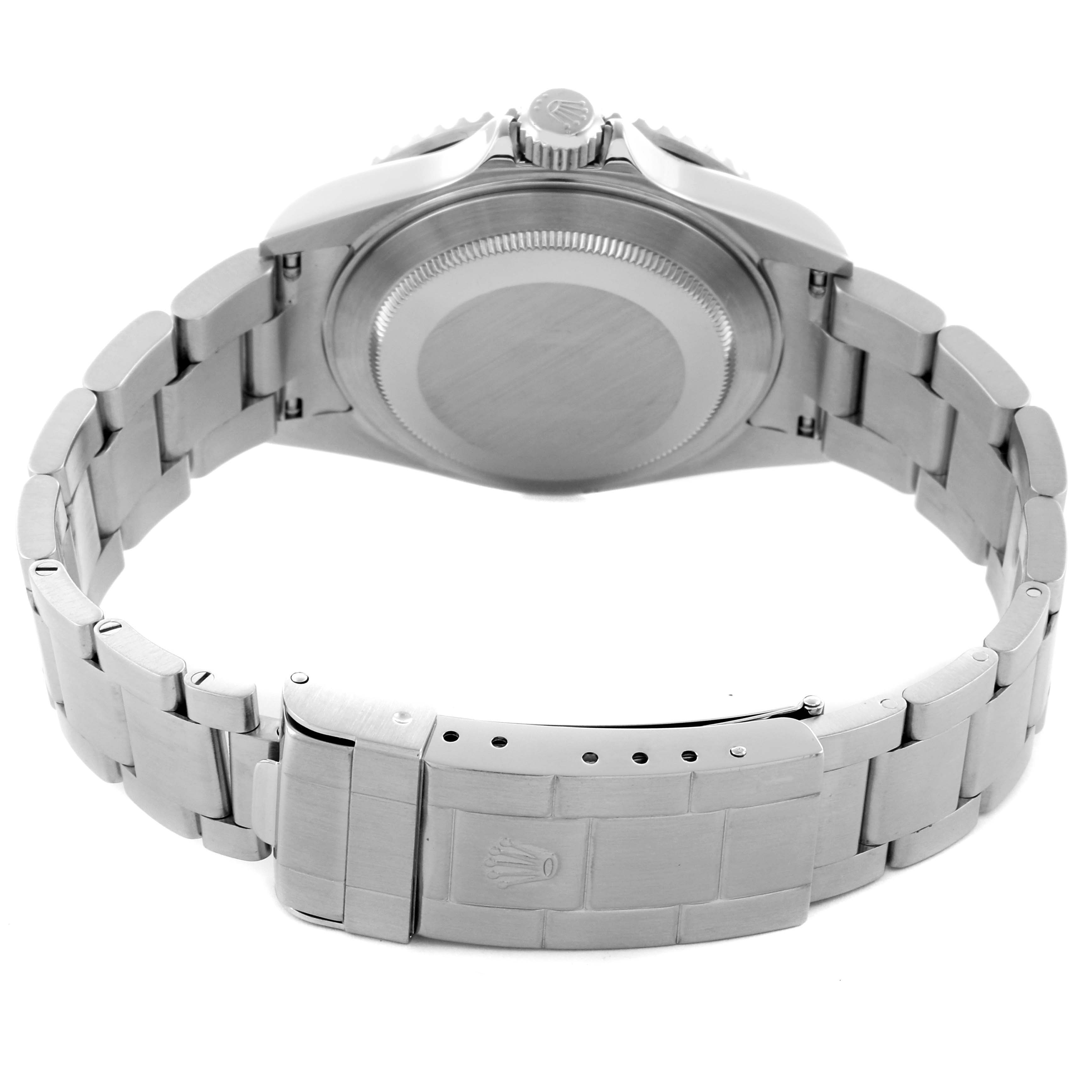 The image shows the Rolex Submariner 16610 Men
s Stainless Steel Black Dial 16610 Men
s Stainless Steel Black Dial from the back, highlighting the case back and the bracelet clasp.