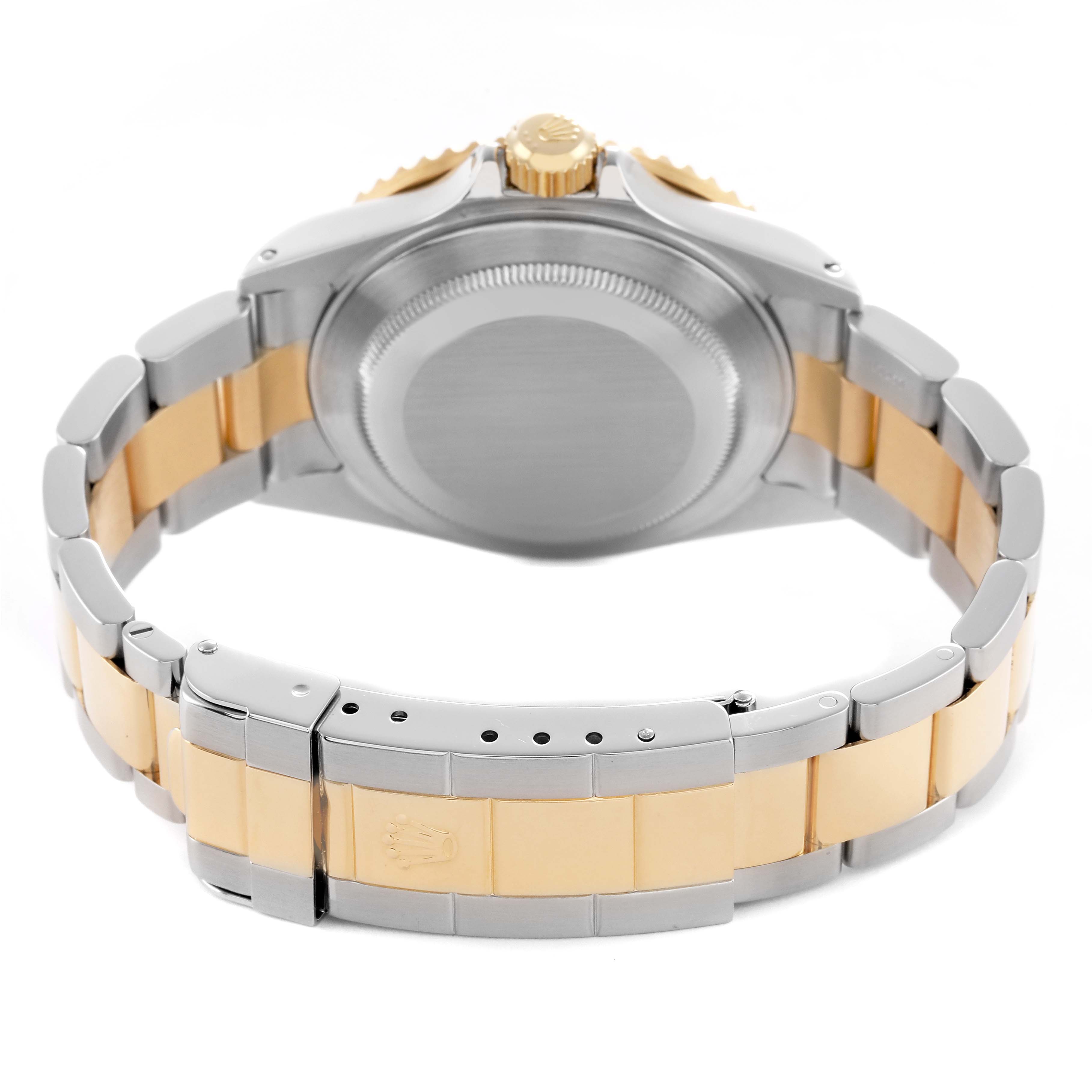 The Rolex Submariner 16613 Men's Steel and Gold (two tone) Blue Dial is shown from the back, highlighting the bracelet, clasp, and case back.