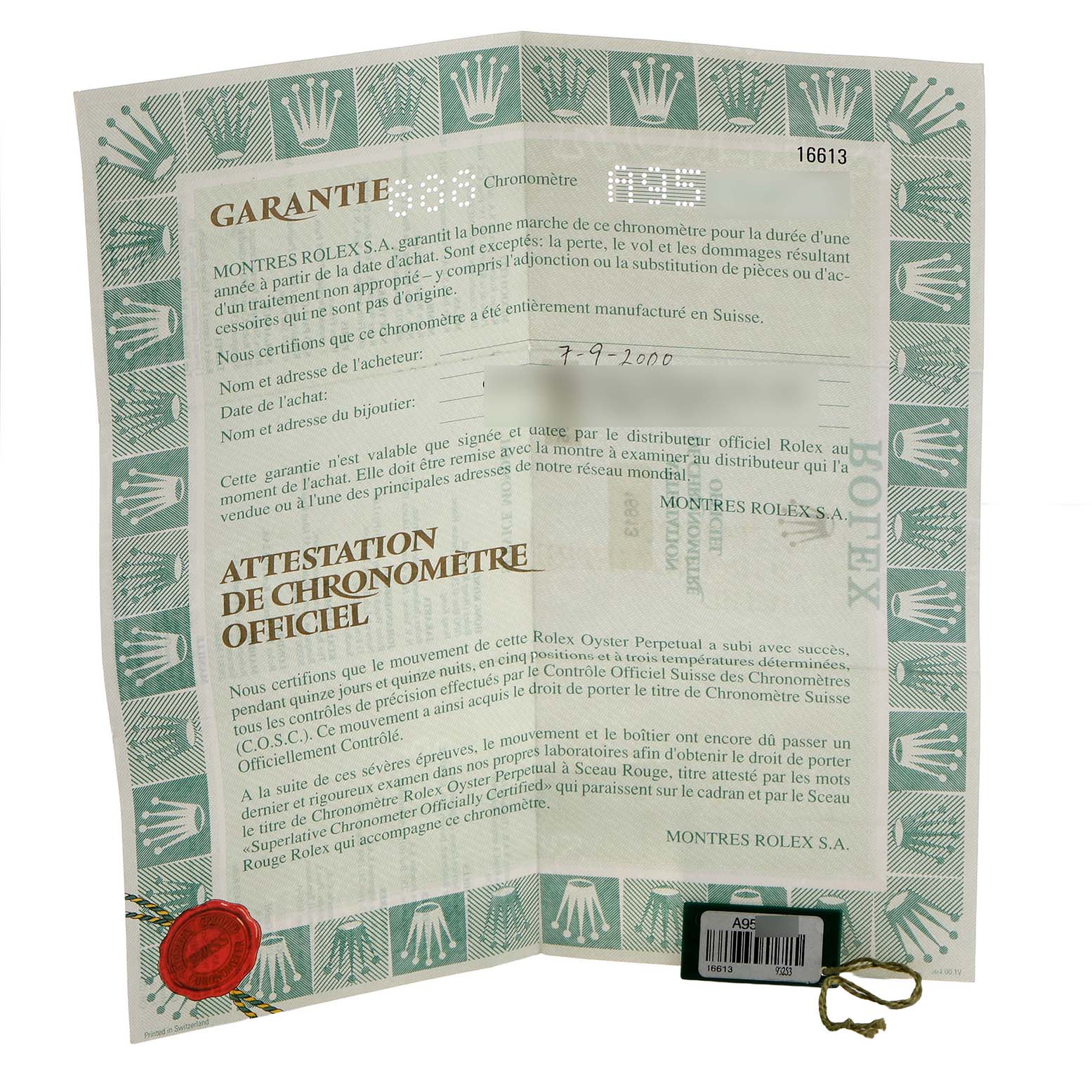 The image shows a folded warranty certificate and certification document for the Rolex Submariner 16613 Men's Steel and Gold (two tone) Blue Dial.