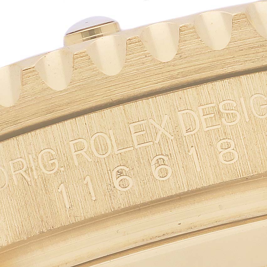 This image shows a close-up view of the case edge and engraved model number of a Rolex Submariner 116618LB Men's Yellow Gold Blue Dial 116618LB Men's Yellow Gold Blue Dial.