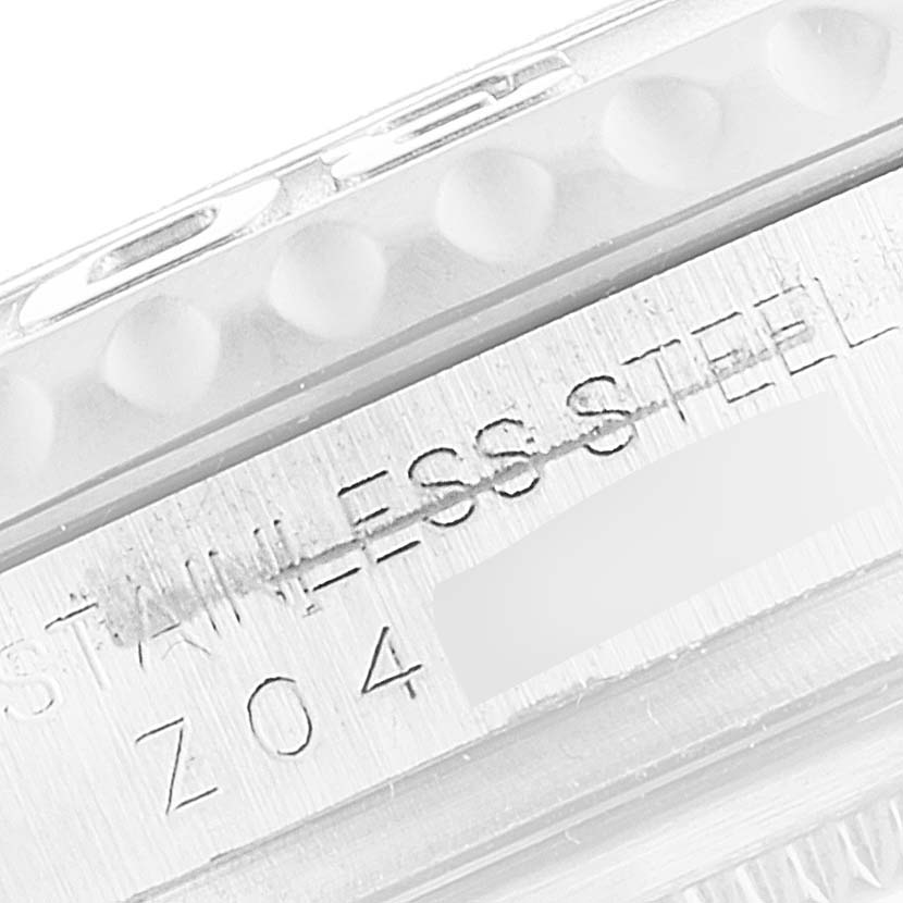 The image shows a close-up of the side of a Rolex Yacht-Master 16622 Men
s Stainless Steel Silver Dial 16622 Men
s Stainless Steel Silver Dial watch, highlighting the "STAINLESS STEEL" engraving.