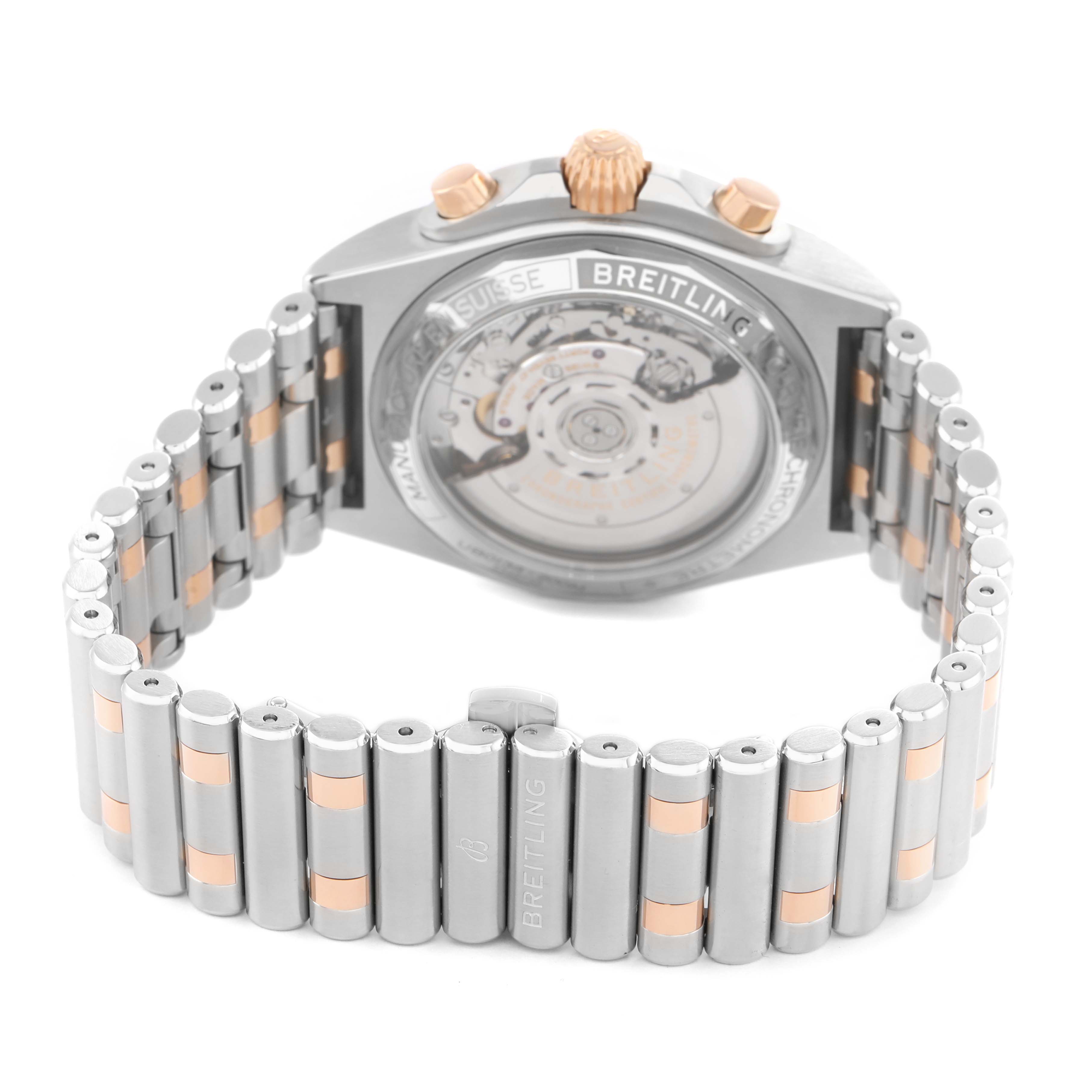 The Breitling Chronomat UB0134 Men's Steel and Gold (two tone) Grey Dial is shown from the back, highlighting the transparent case back and metal bracelet.