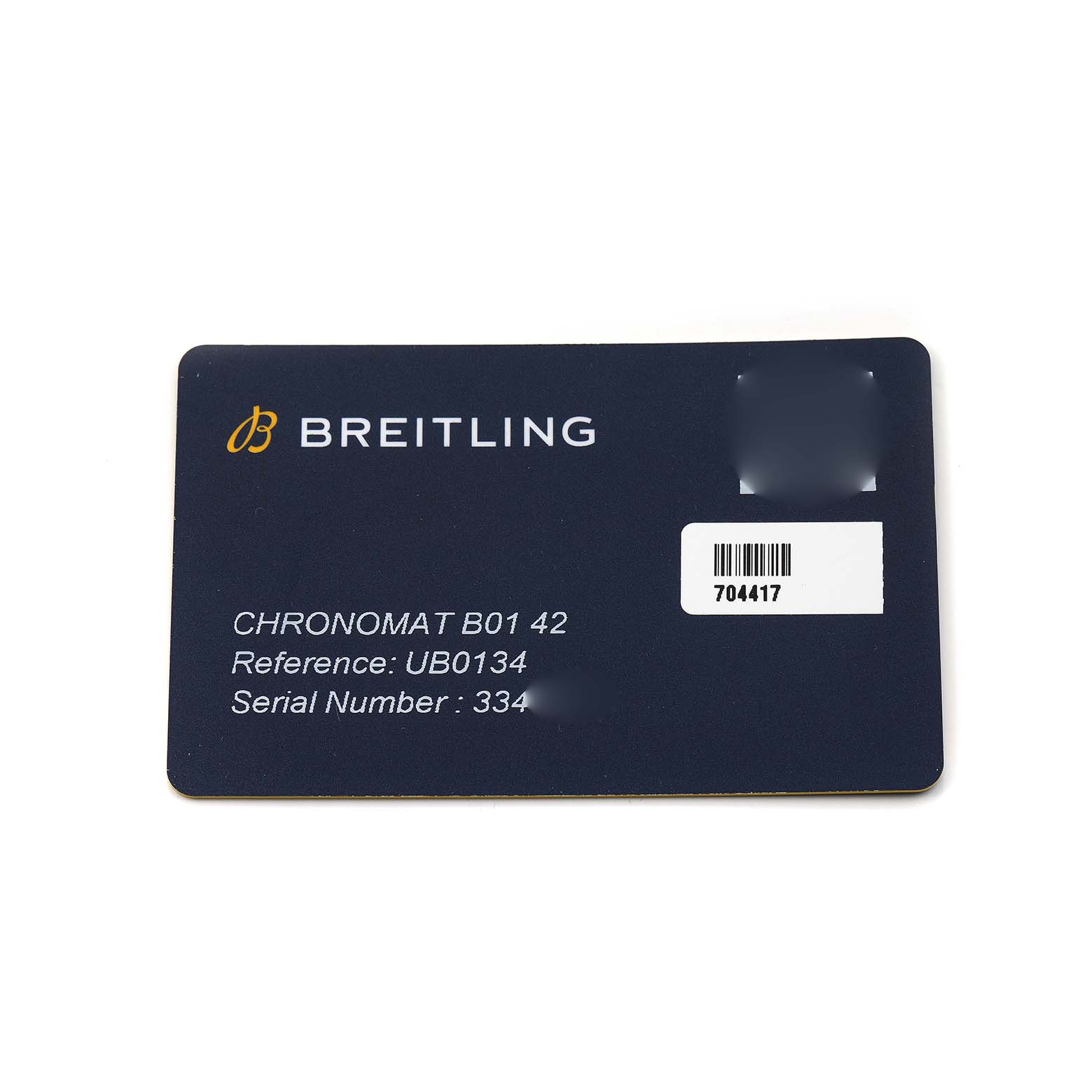 The image shows a Breitling Chronomat UB0134 Men's Steel and Gold (two tone) Grey Dial model warranty card with reference and serial numbers visible.
