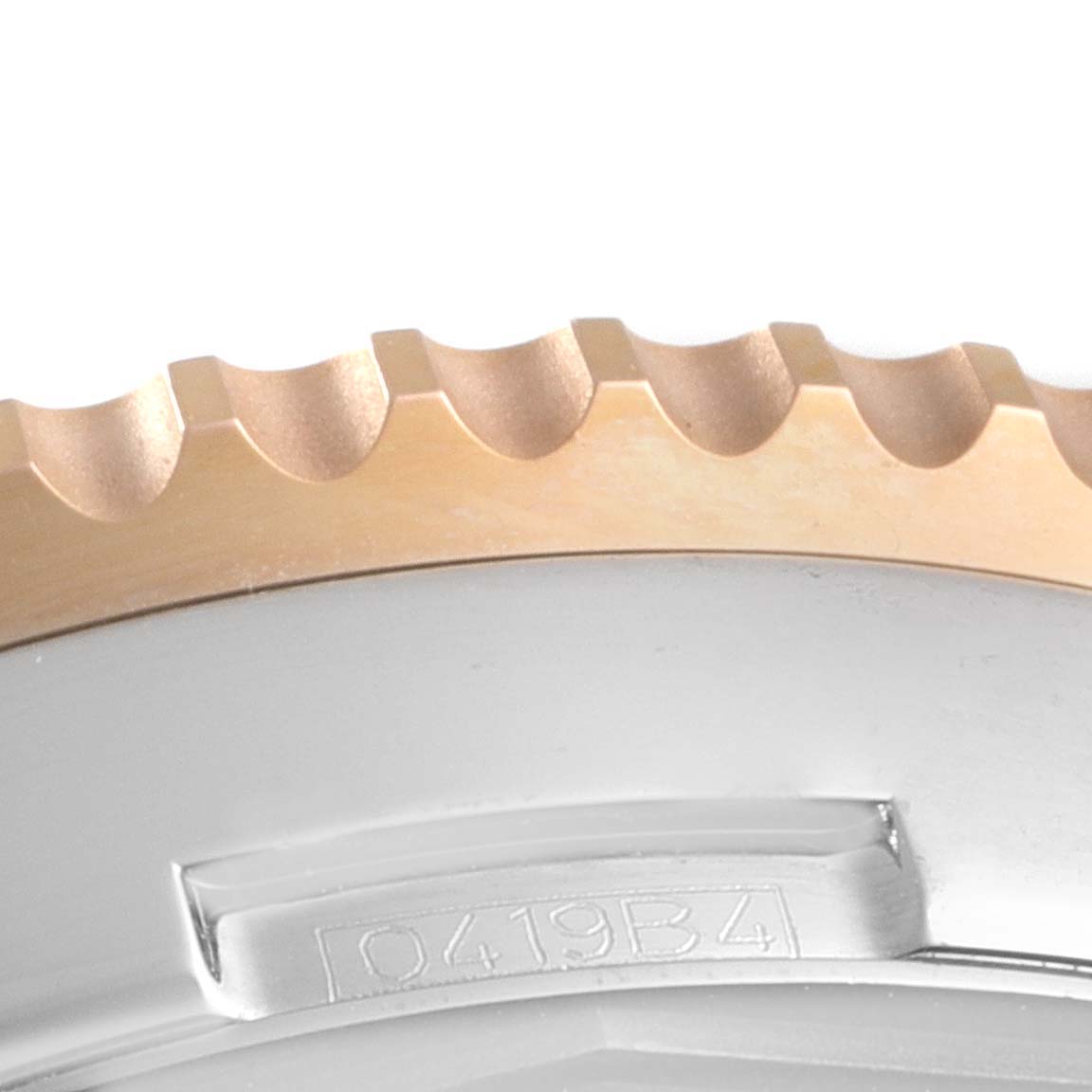 The image shows a close-up of the bezel and part of the casing of a Breitling Navitimer UB0127 Men's Steel and Gold (two tone) Black Dial UB0127 Men's Steel and Gold (two tone) Black Dial watch.