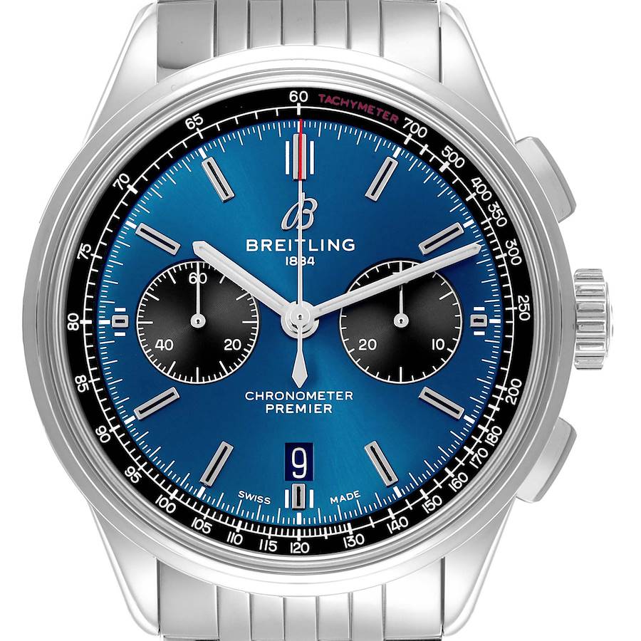The Breitling Premier watch is shown from the front, featuring its blue dial, chronograph sub-dials, and stainless steel bracelet.