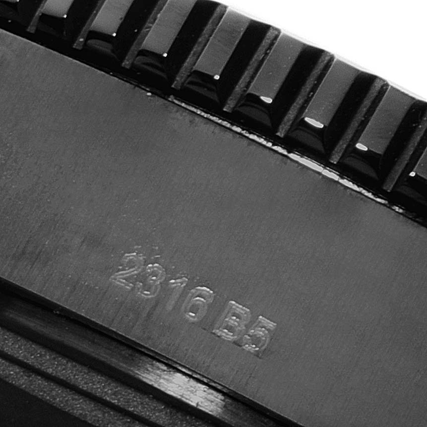 The image shows a close-up of the bezel and part of the engraved casing of a Breitling Superocean M17393 Men's Stainless Steel Black Dial M17393 Men's Stainless Steel Black Dial watch.