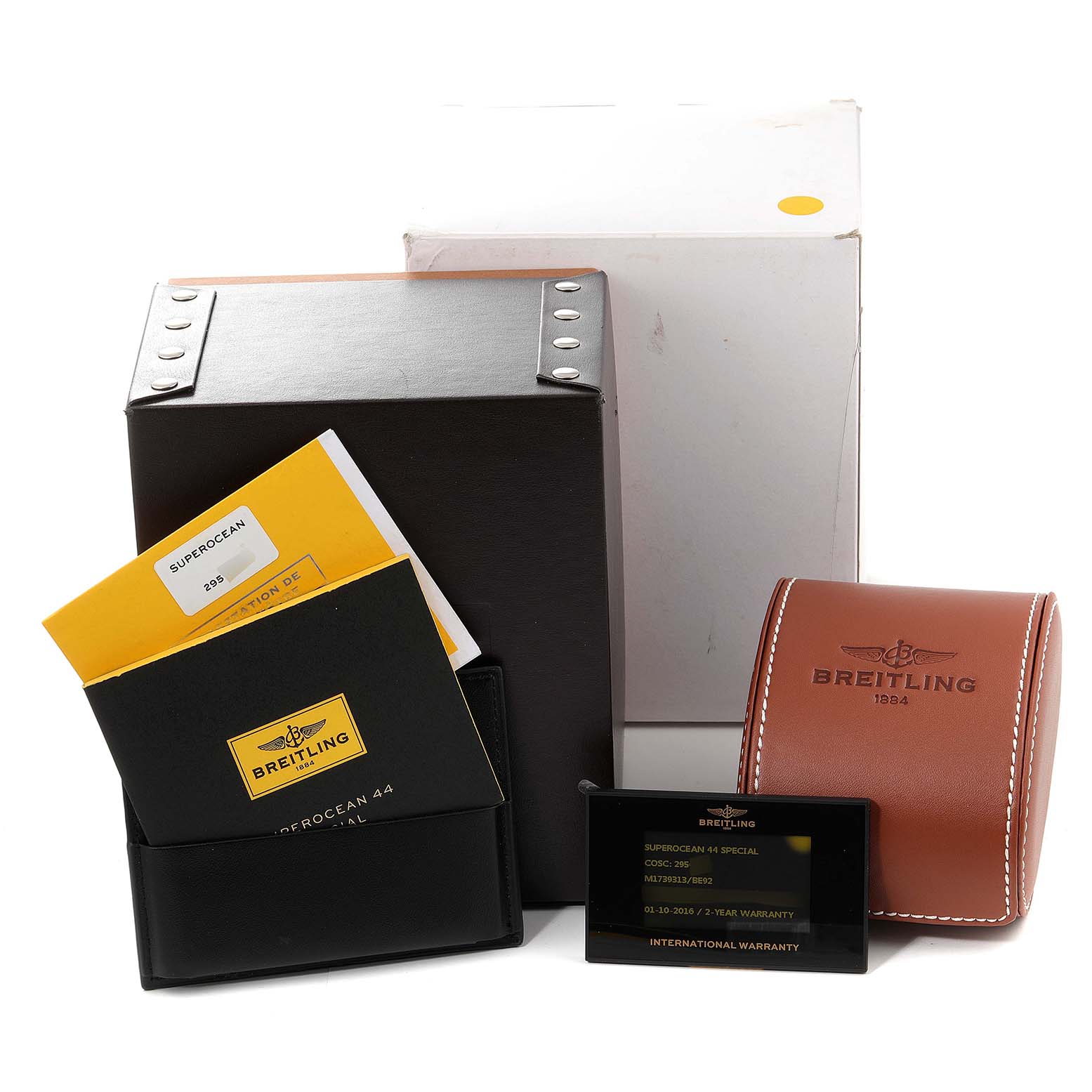 The image shows accessories for a Breitling Superocean M17393 Men's Stainless Steel Black Dial M17393 Men's Stainless Steel Black Dial, including a warranty card, manuals, and packaging.