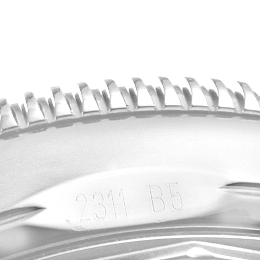 This close-up image shows the knurled bezel and part of the casing with engraved numbers on the Breitling Superocean A17321 Men
s Stainless Steel Black Dial A17321 Men
s Stainless Steel Black Dial watch.