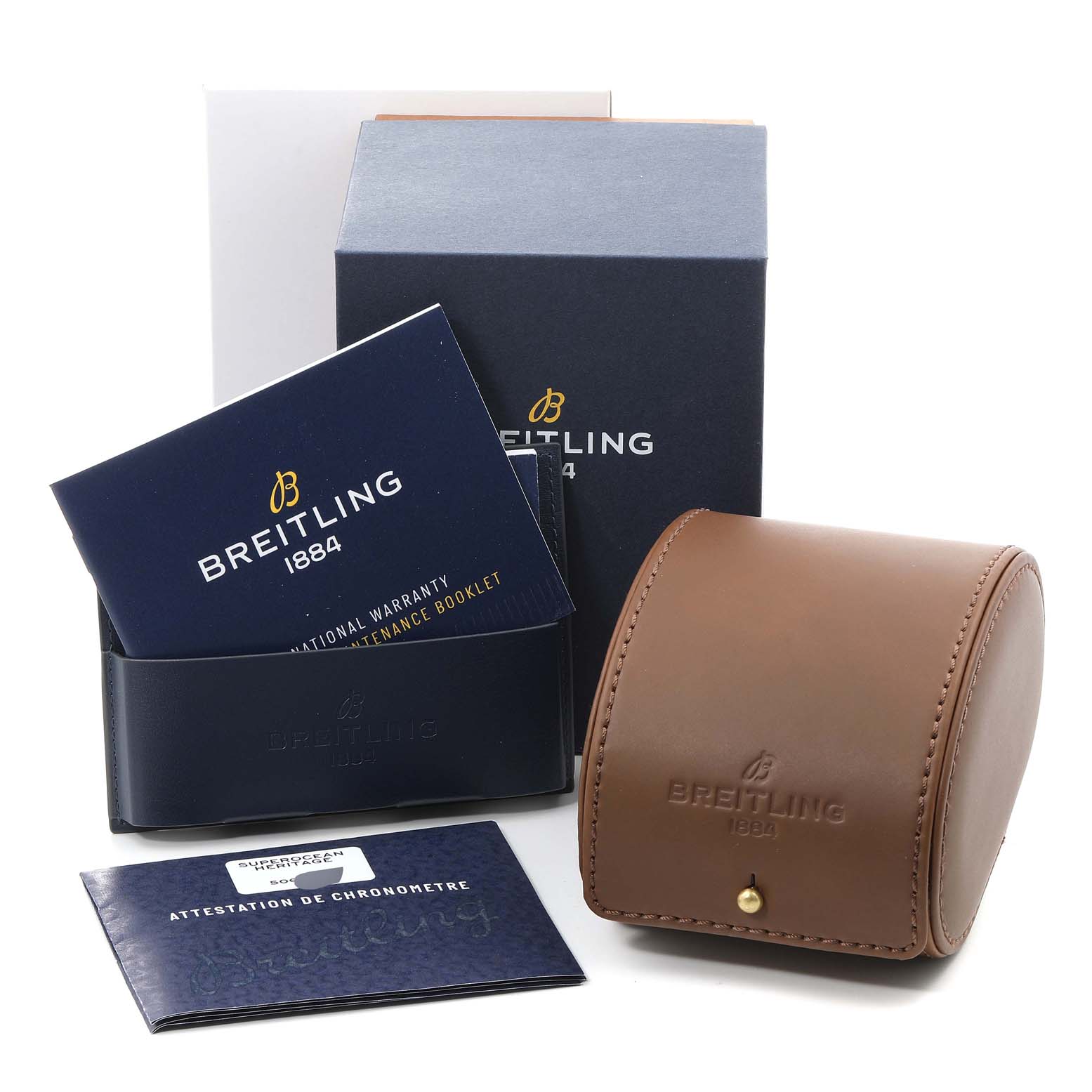This image shows the Breitling Superocean AB202016-C961-152A Men
s Stainless Steel Blue Dial AB202016-C961-152A Men
s Stainless Steel Blue Dial watch packaging, warranty booklets, and a brown leather watch case.