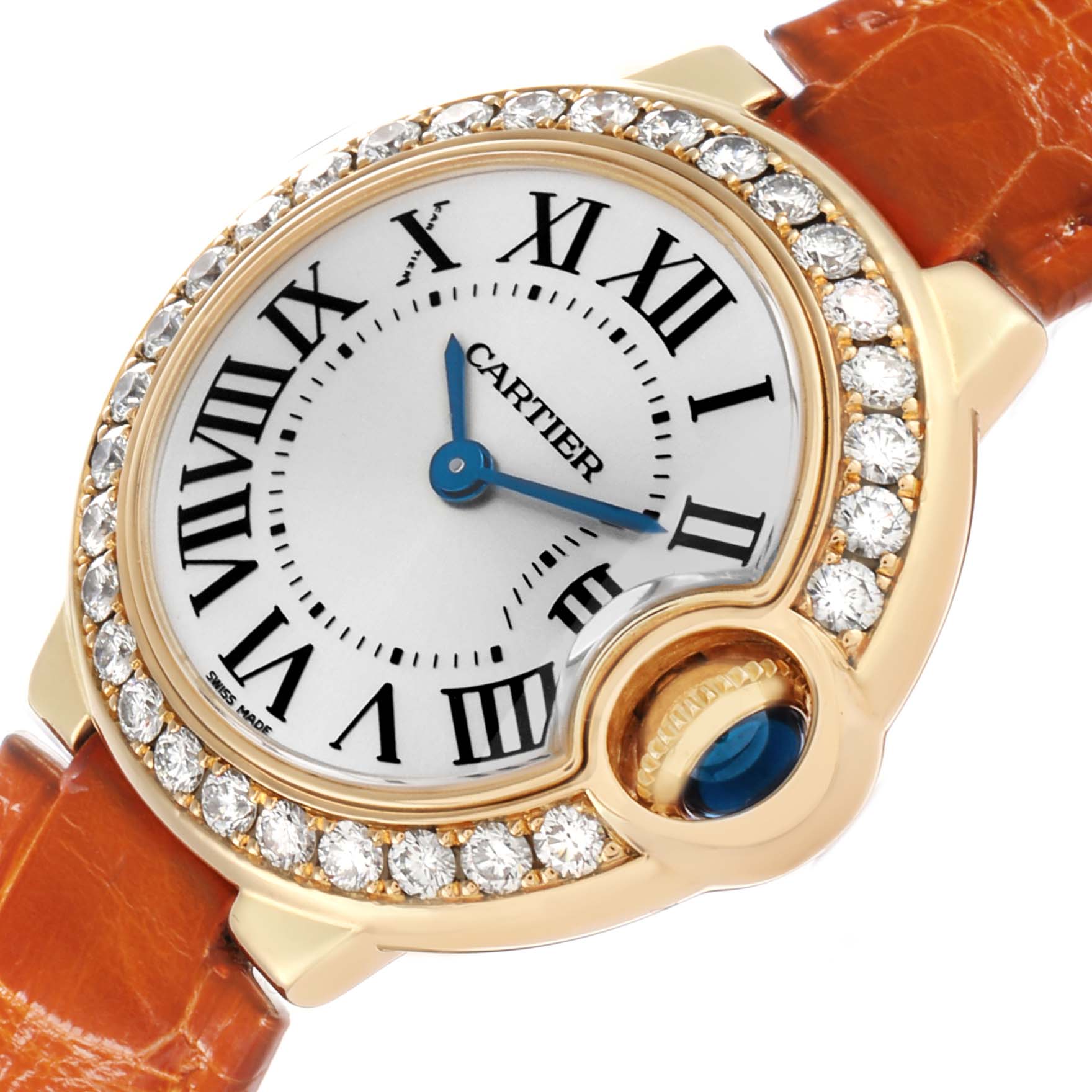 The Cartier Ballon Bleu WE900151 Women's Yellow Gold Silver Dial watch is shown at an angle highlighting its diamond-set bezel, white dial, and orange leather strap.