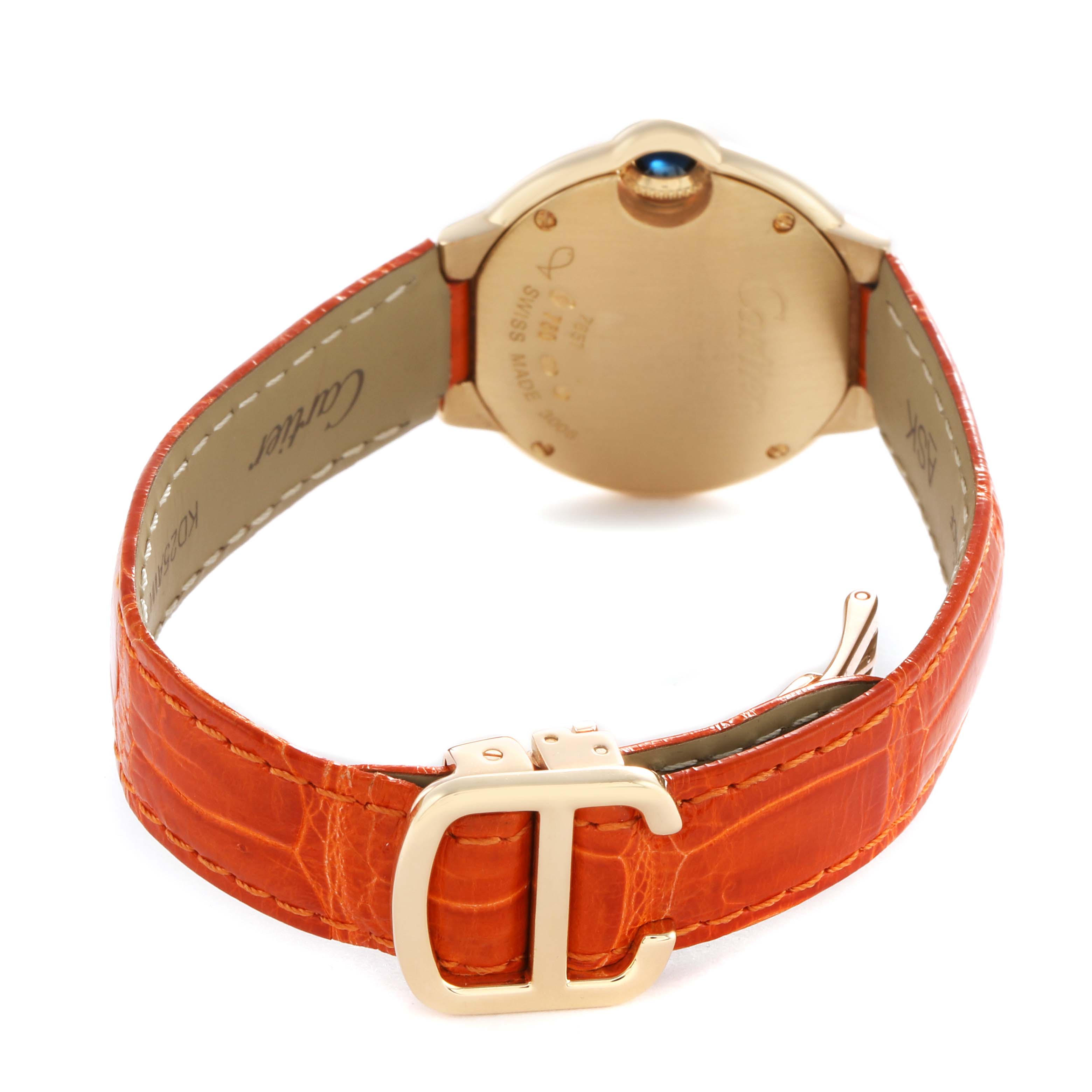 The image shows the back of a Cartier Ballon Bleu WE900151 Women's Yellow Gold Silver Dial watch with an orange leather strap and a visible clasp.