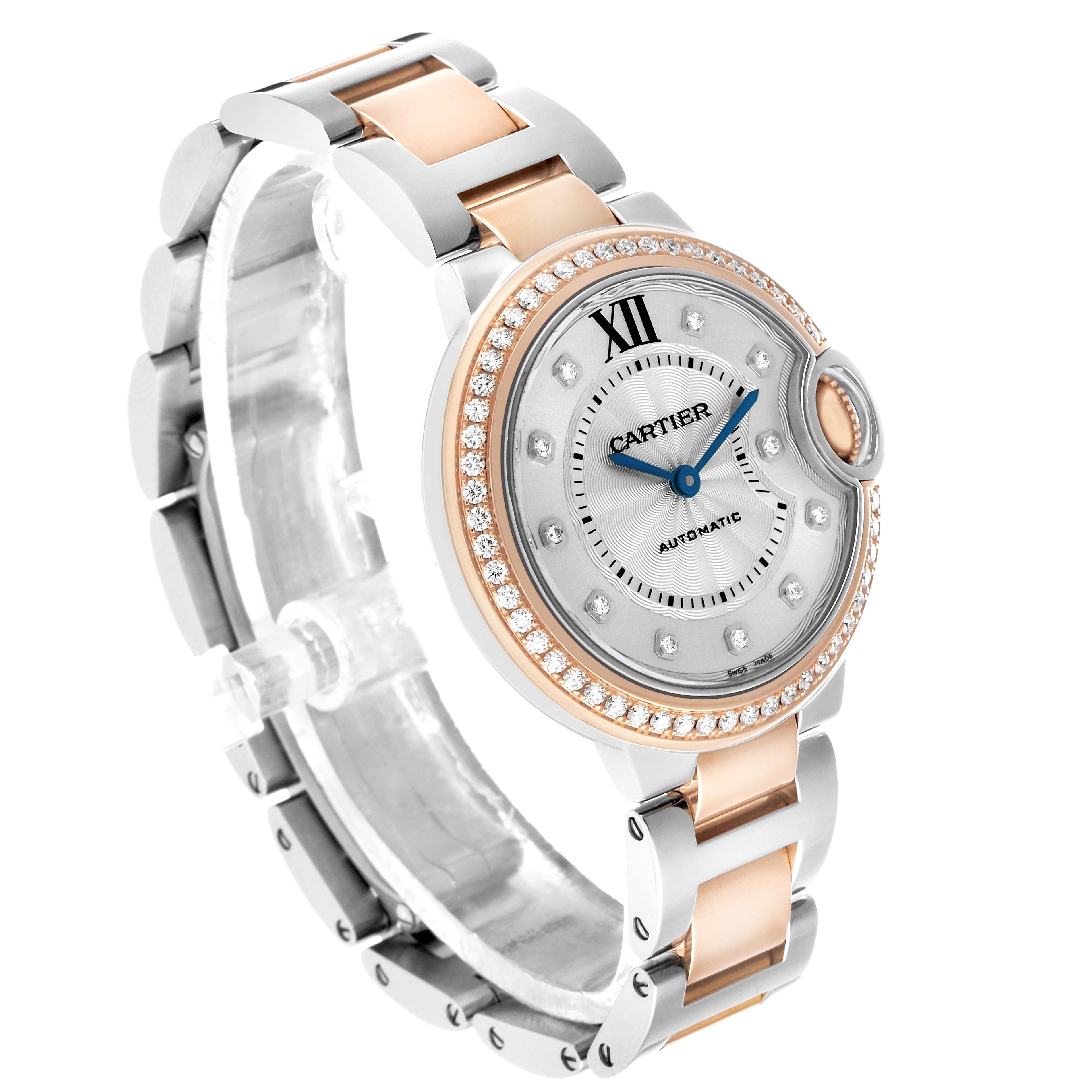 The Cartier Ballon Bleu WE902077 Women's Steel and Gold (two tone) Silver Dial watch is shown at an angled view, highlighting the dial, bezel, and two-tone bracelet.