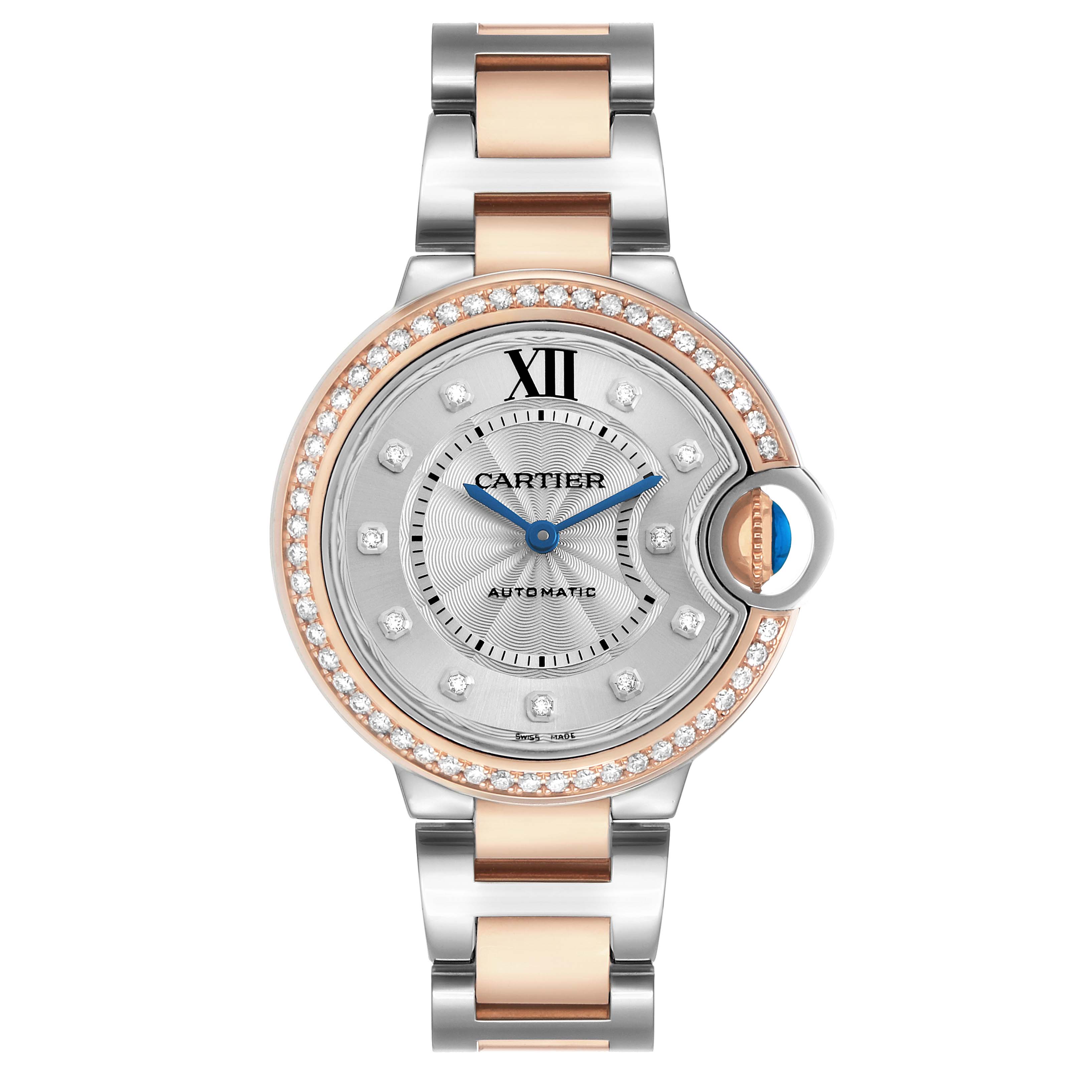 The Cartier Ballon Bleu WE902077 Women's Steel and Gold (two tone) Silver Dial watch is shown from the front, highlighting its round face, bracelet, diamond bezel, and blue cabochon crown.