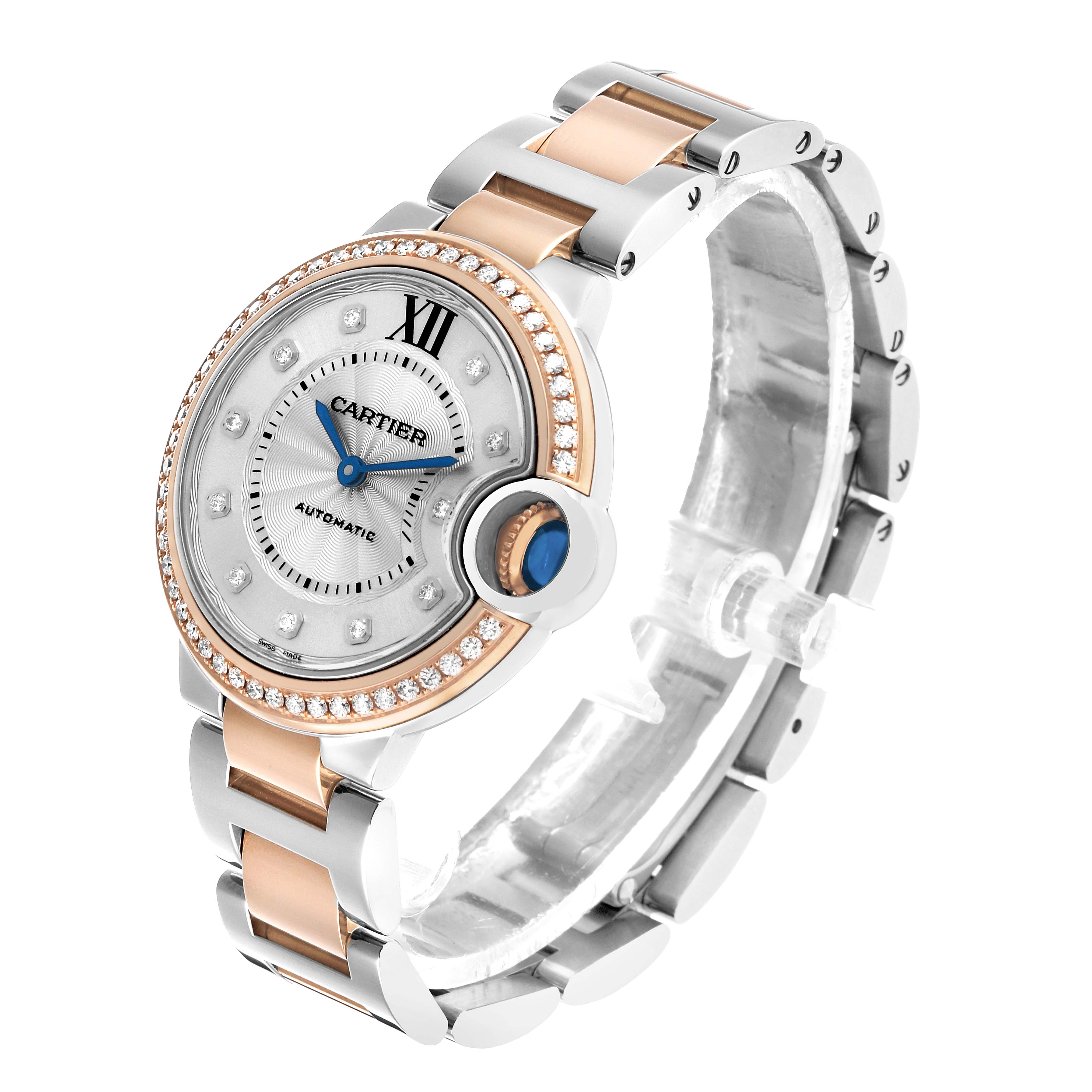 The Cartier Ballon Bleu WE902077 Women's Steel and Gold (two tone) Silver Dial watch is shown at a three-quarter angle, highlighting the diamond bezel, dial, and two-tone bracelet.