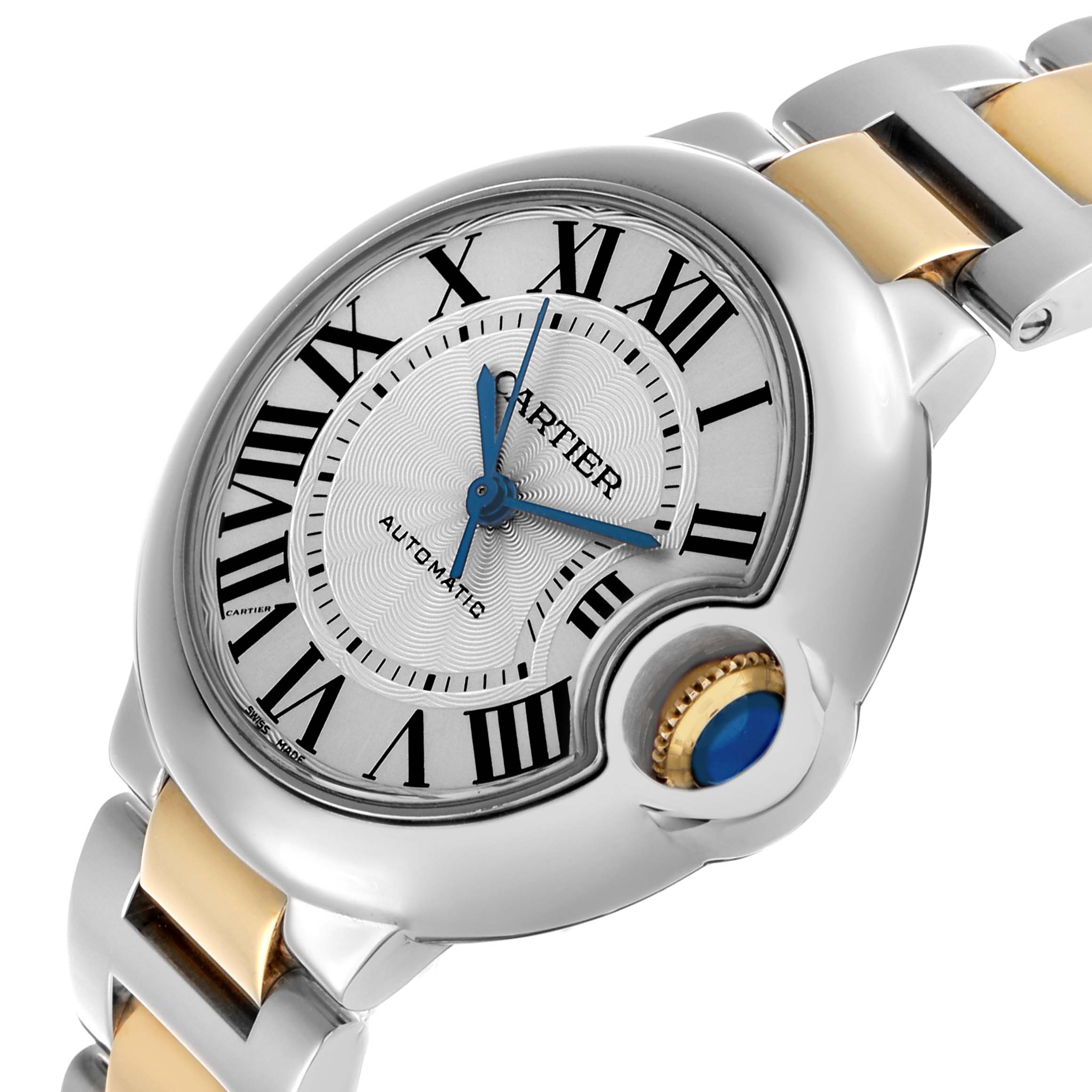 The Cartier Ballon Bleu W2BB0002 Women's Steel and Gold (two tone) Silver Dial watch is shown from a front-side angle, highlighting the Roman numeral dial, blue hands, and cabochon crown.
