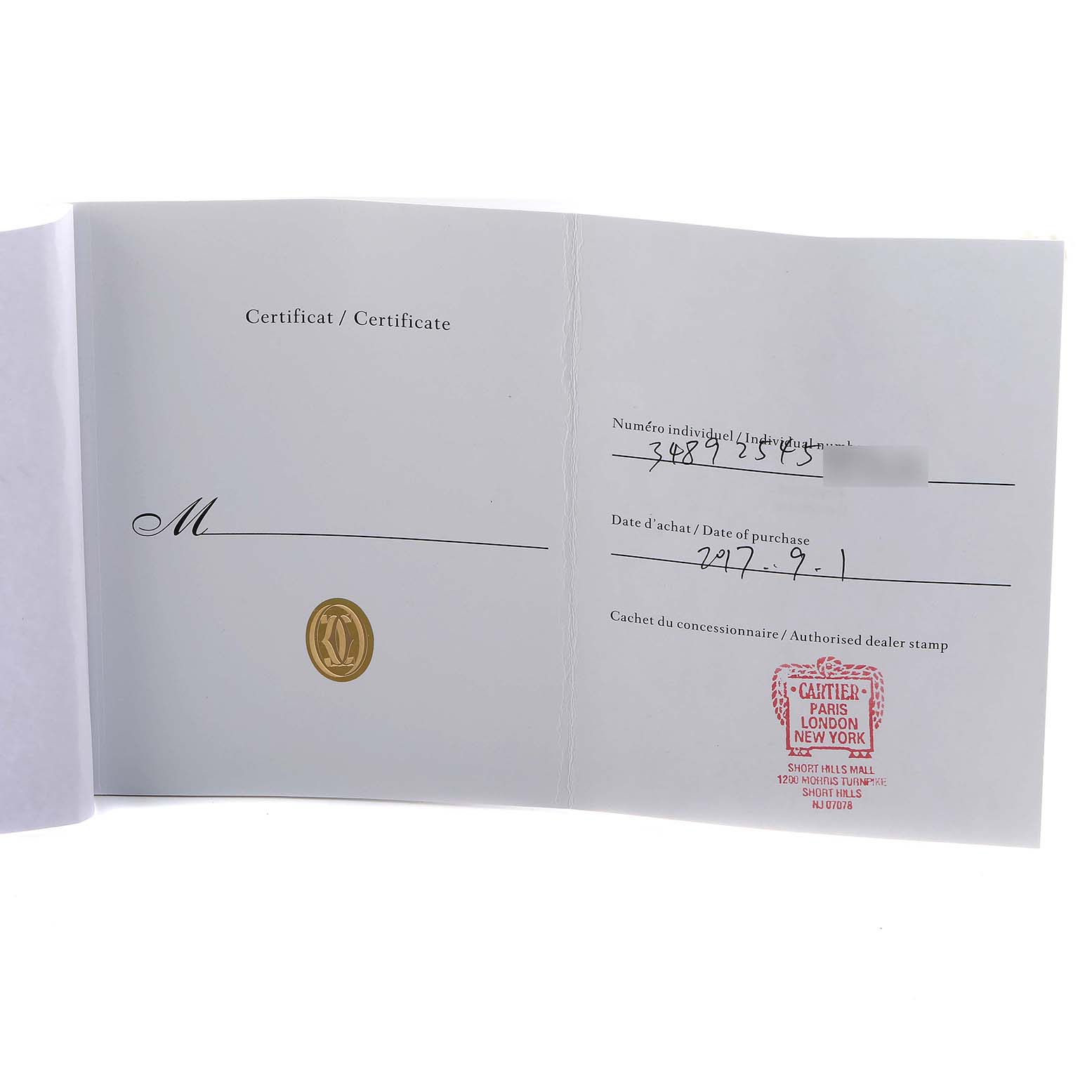 This image shows the open certificate for a Cartier Ballon Bleu W2BB0002 Women's Steel and Gold (two tone) Silver Dial, displaying the serial number and authorized dealer stamp.