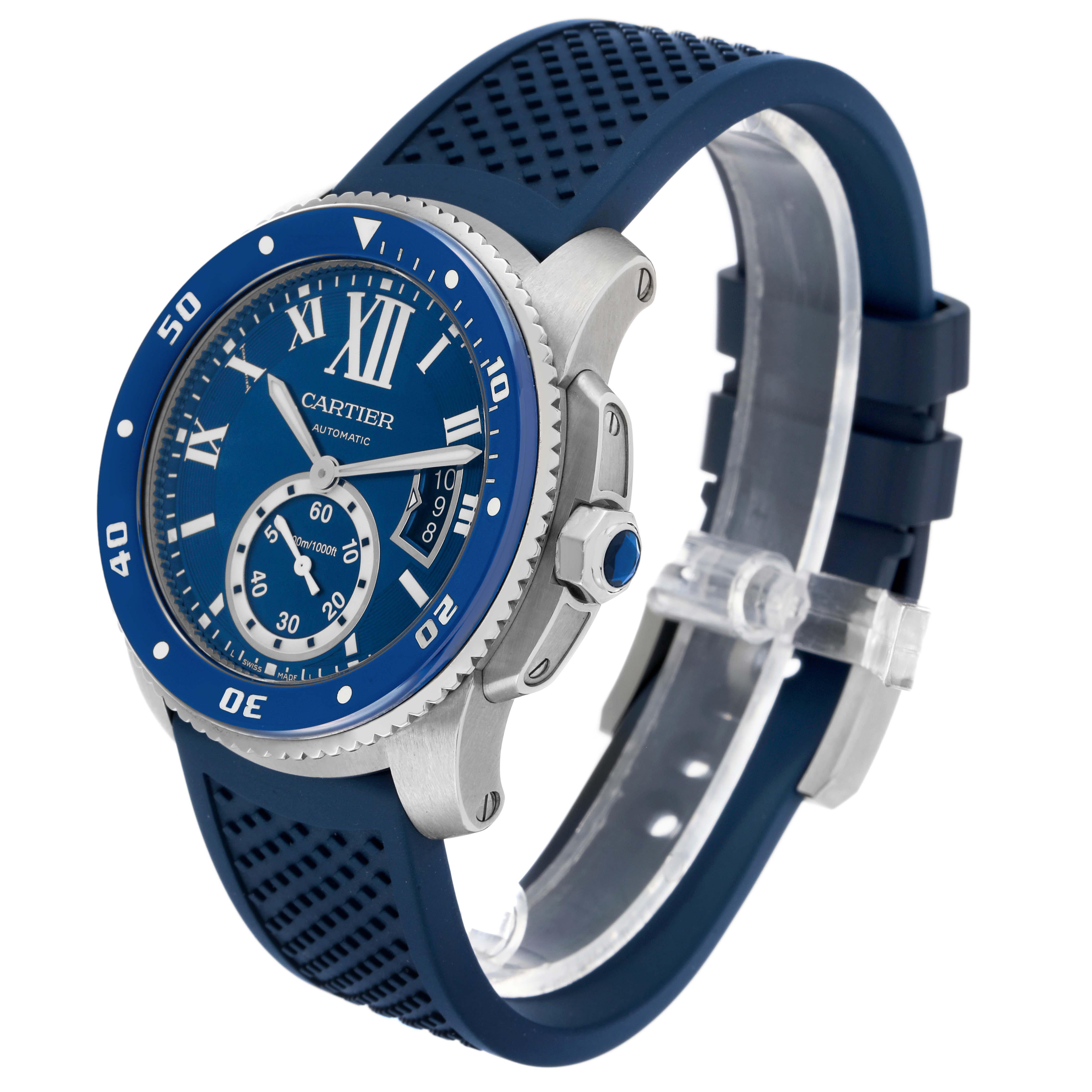 The Calibre de Cartier watch is shown at a three-quarter angle, highlighting the bezel, crown, and blue strap.