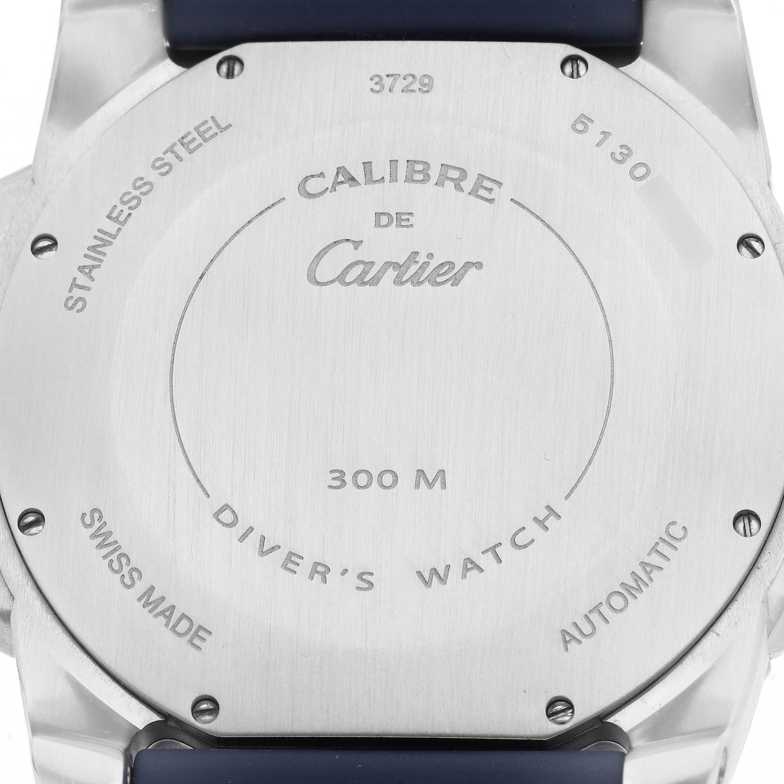 The image shows the back case of the Calibre de Cartier watch, displaying its markings and specifications.