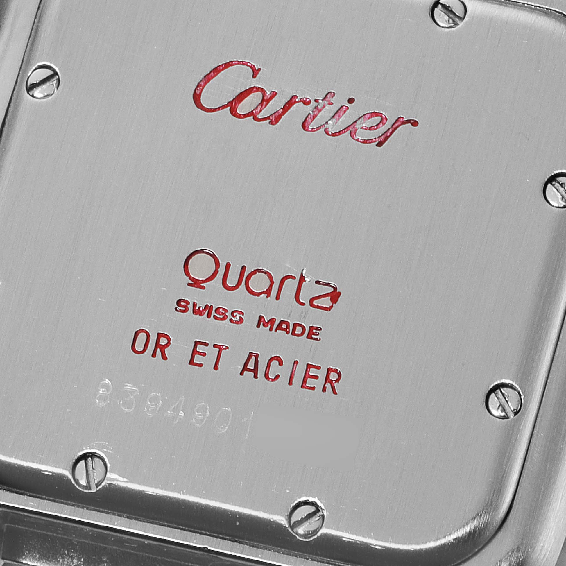 This image shows the back case of a Cartier Panthère quartz watch, detailing its material and origin.