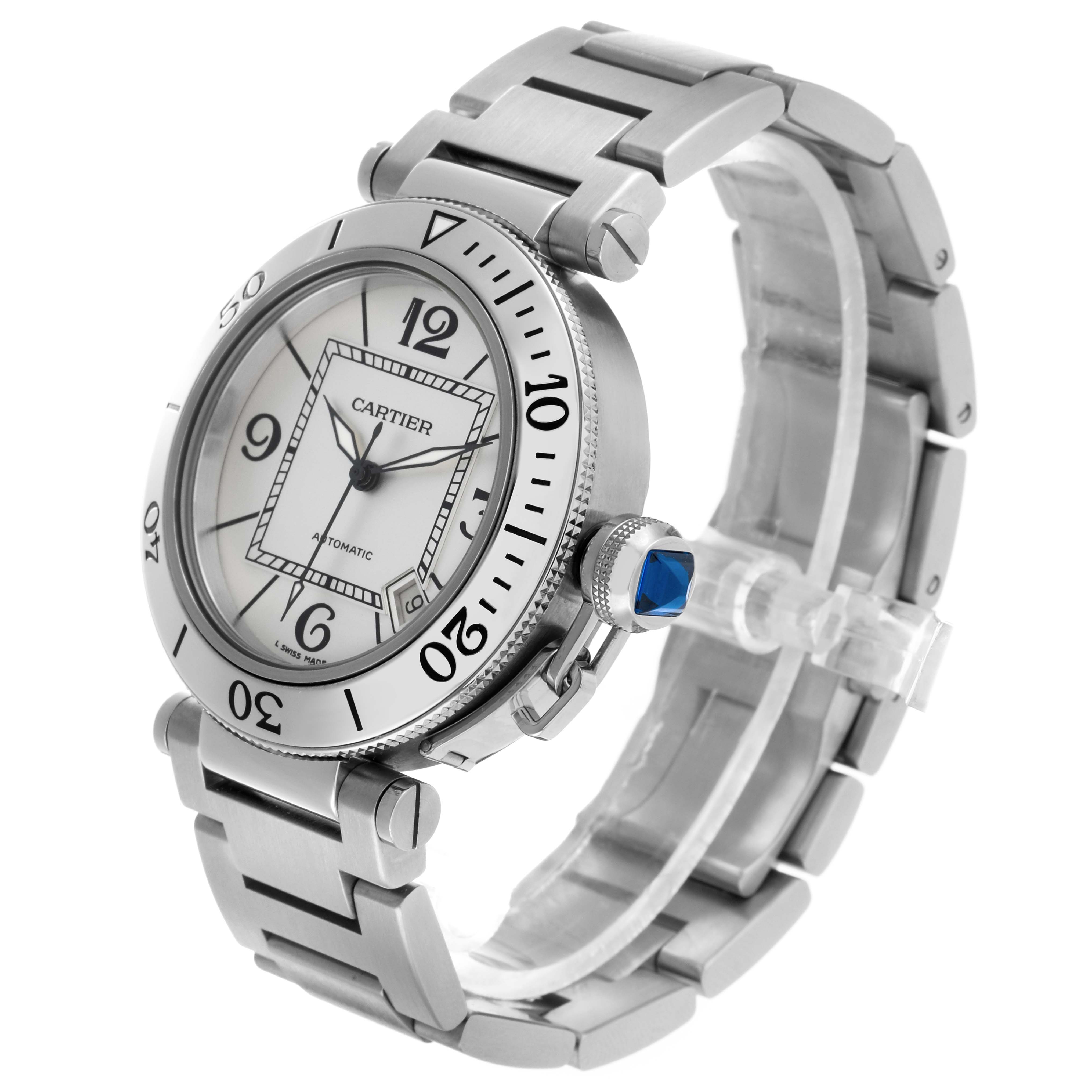 The Calibre de Cartier watch by Cartier is shown at an angled side view, highlighting the dial, bezel, crown, and bracelet.