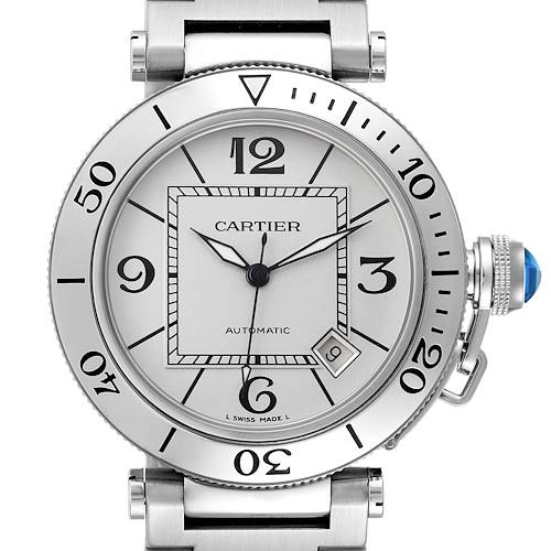 The Calibre de Cartier watch is shown from the front, displaying the dial, bezel, and part of the metal bracelet.