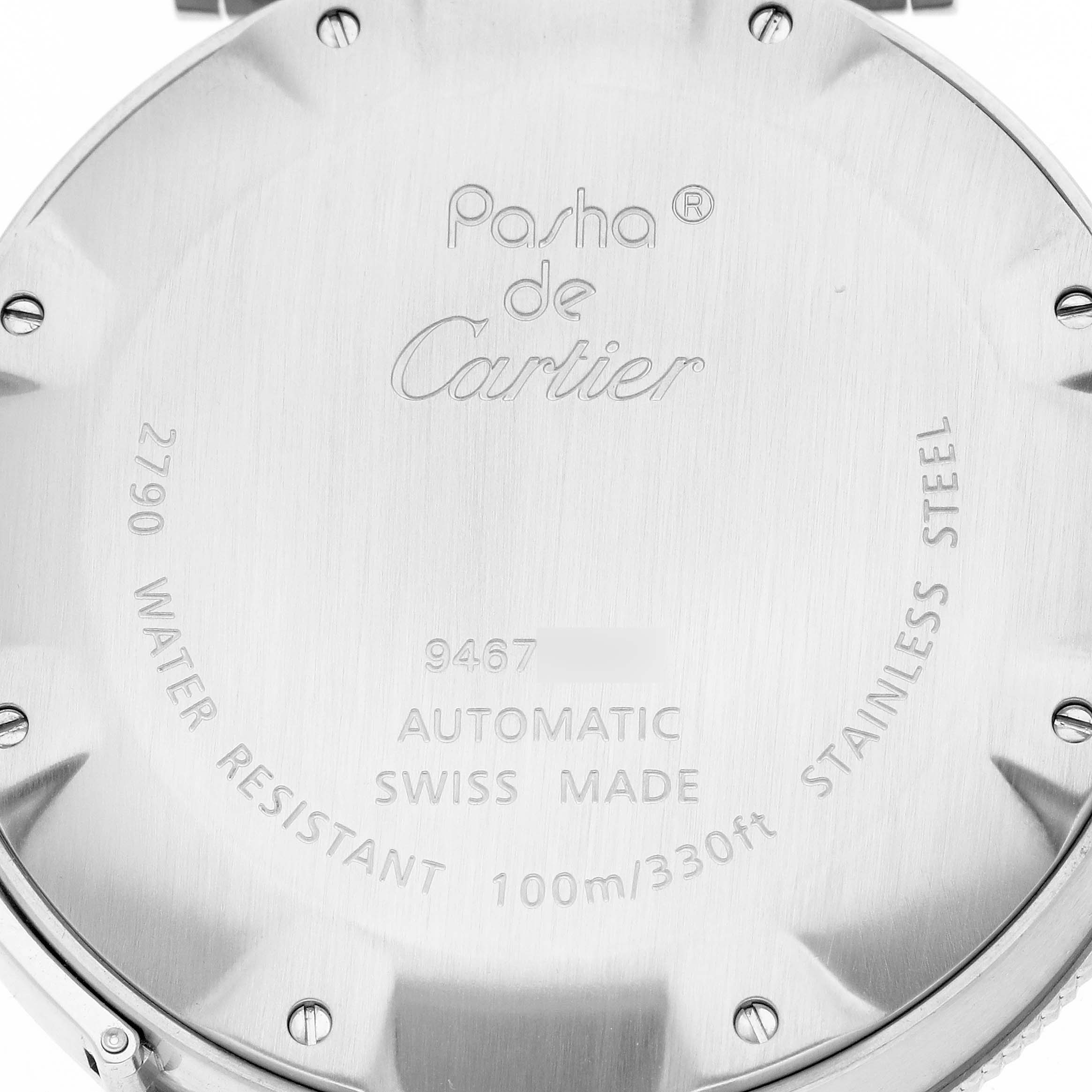 The image shows the back case of a Cartier watch, displaying engravings and details about water resistance and materials.