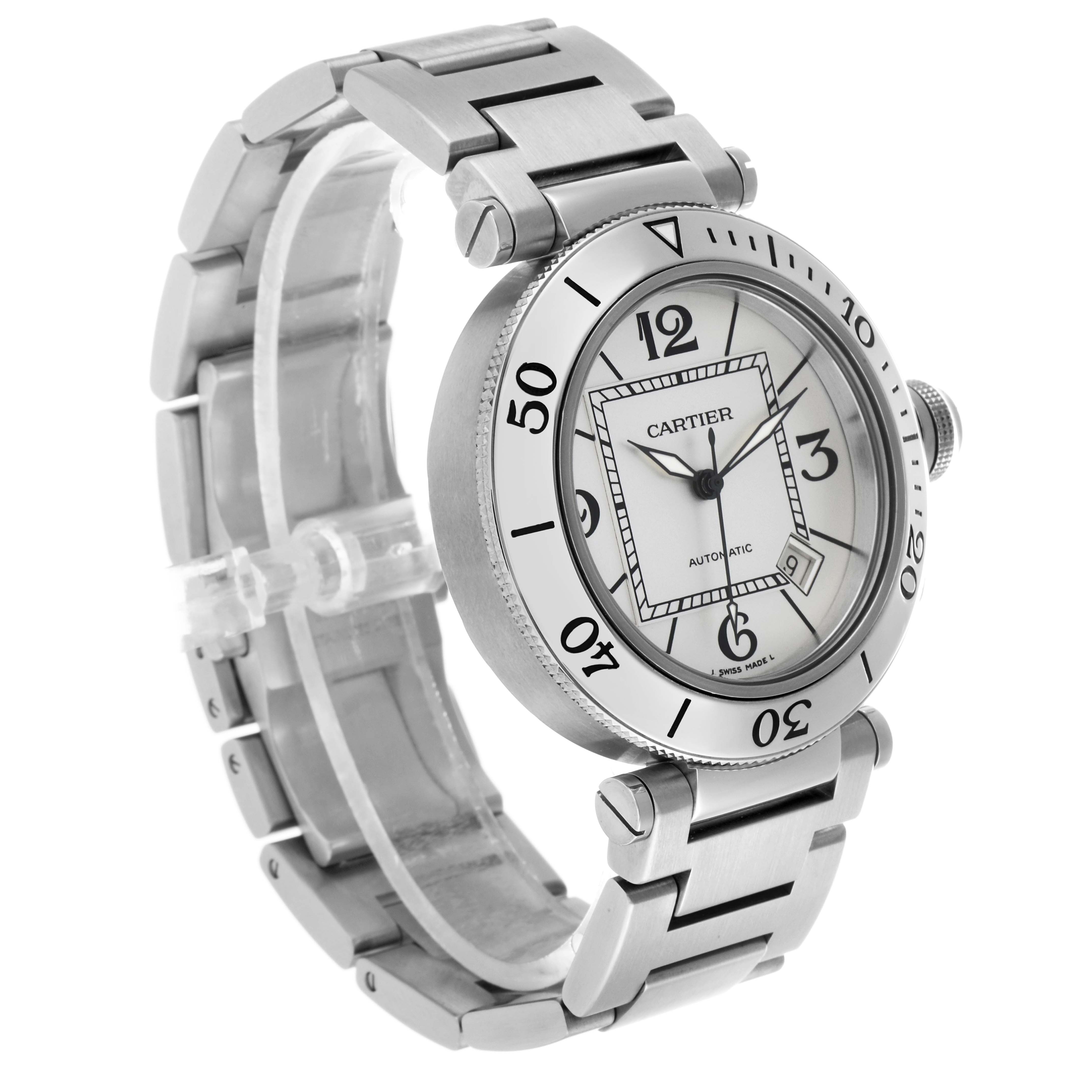 The image shows a Calibre de Cartier watch from a three-quarter angle, highlighting the face, bezel, and metal bracelet.