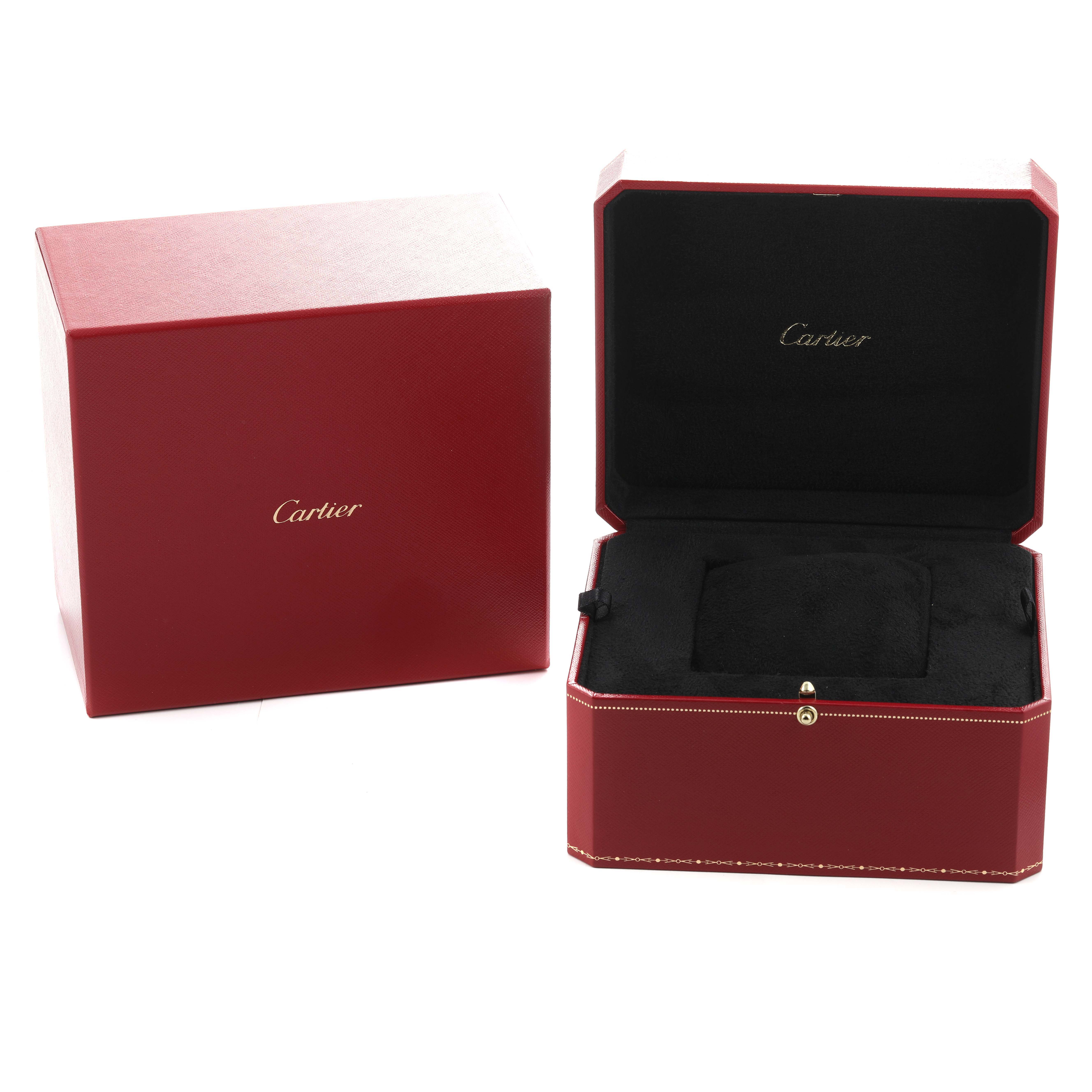 The image shows a Cartier Santos Dumont WHSA0030 Men's Rose Gold Transparent Dial watch box, open, revealing a black interior with a cushion, alongside a closed outer box.