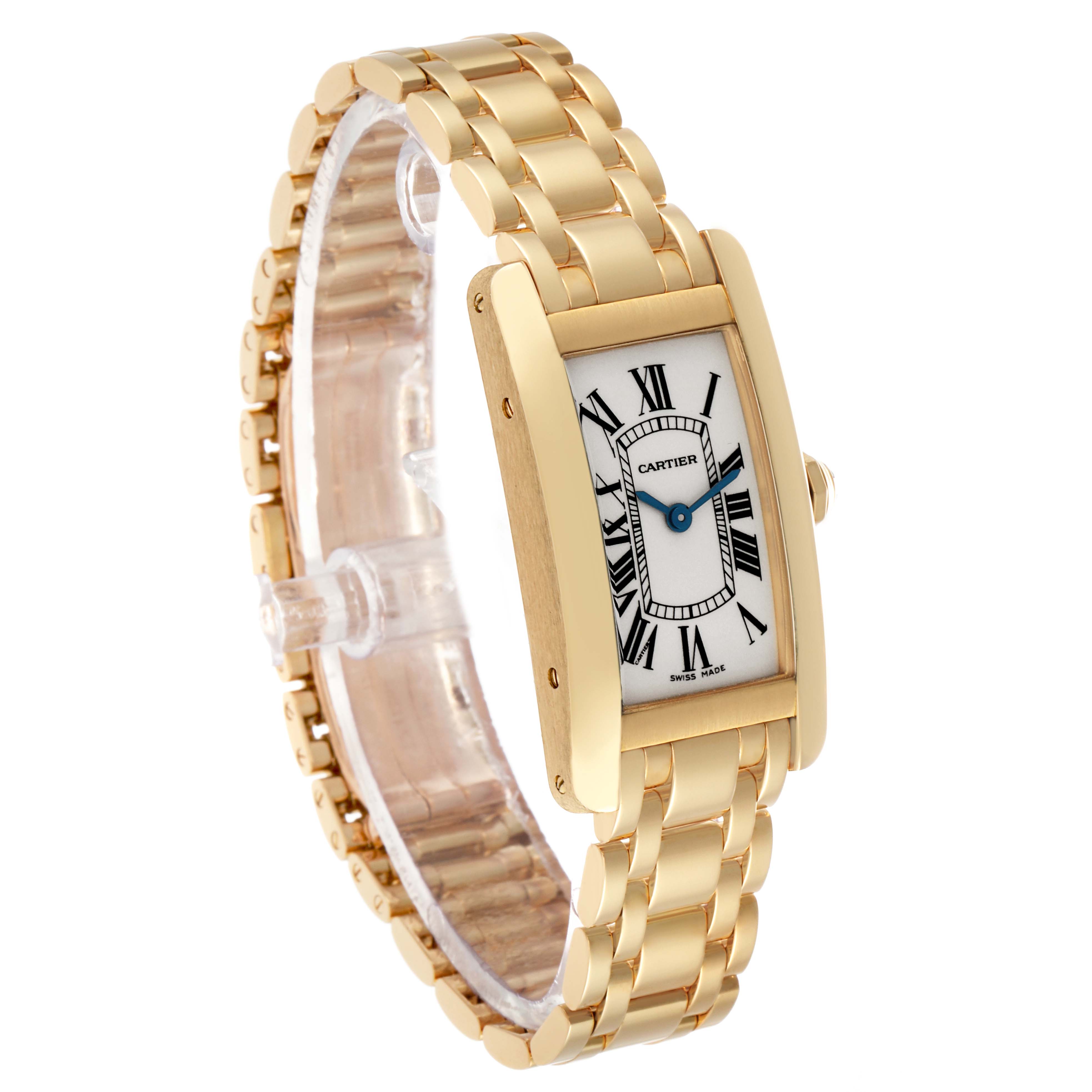 The Cartier Tank Américaine watch is shown at a three-quarter angle, displaying its gold case, bracelet, Roman numerals, and blue hands.