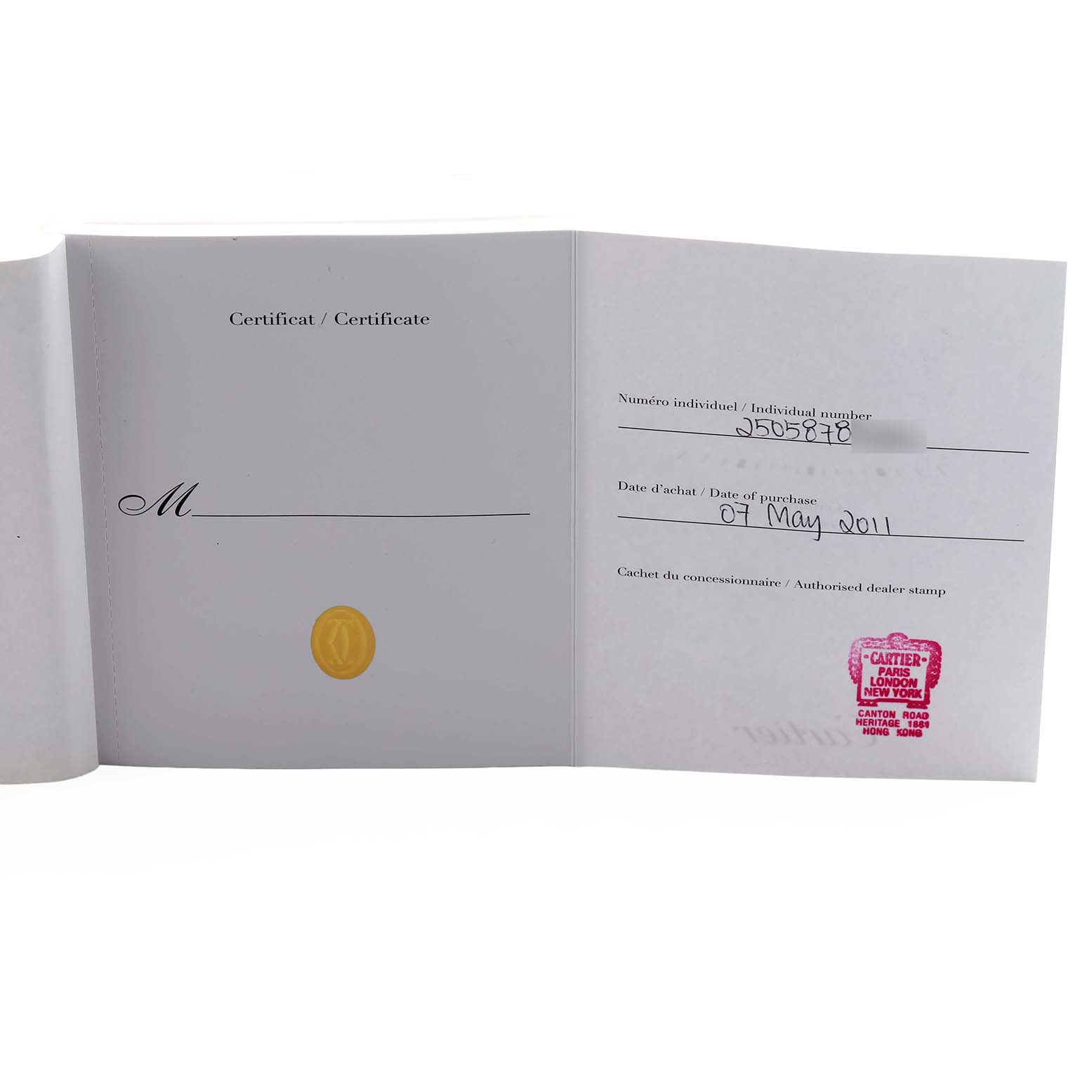 The image shows an open certificate booklet for a Cartier Tank Americaine W2609156 Men's Rose Gold Silver Dial watch, displaying purchase details and a dealer stamp.