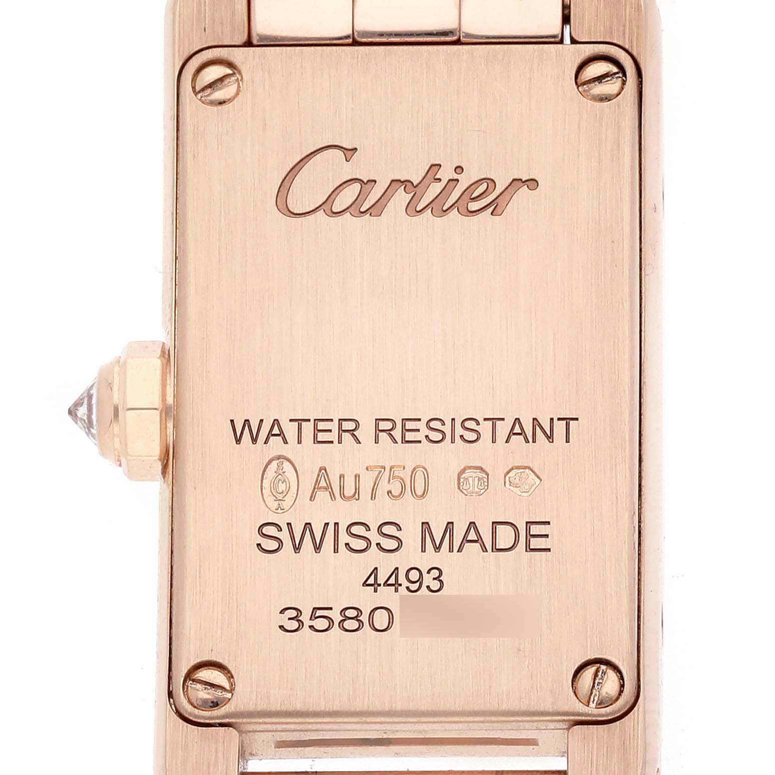 The image shows the back case of the Cartier Tank Americaine WJTA0043 Men's Rose Gold Silver Dial watch, highlighting engravings and the crown side.