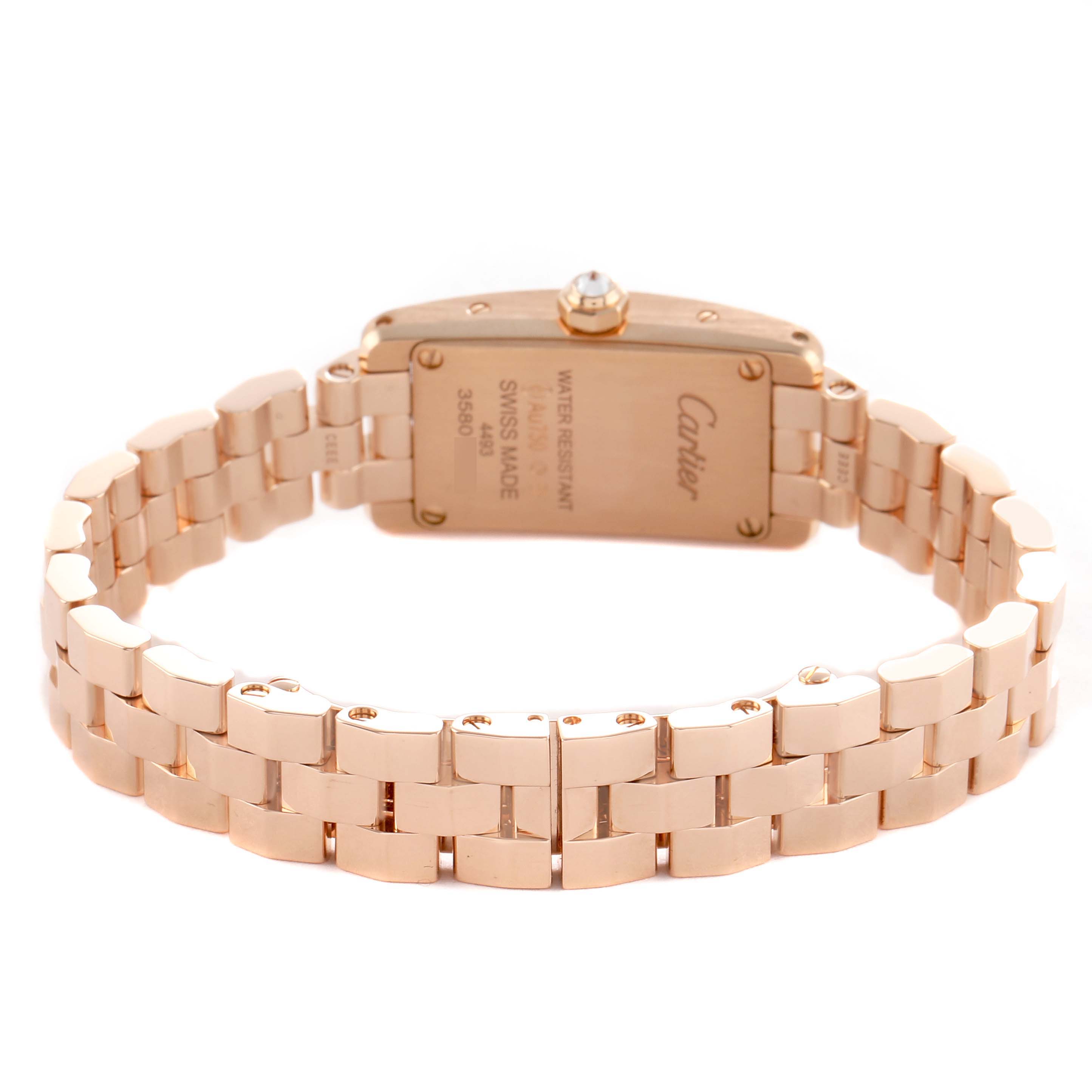 The Cartier Tank Americaine WJTA0043 Men's Rose Gold Silver Dial watch is shown from the back, highlighting its bracelet and case back details.