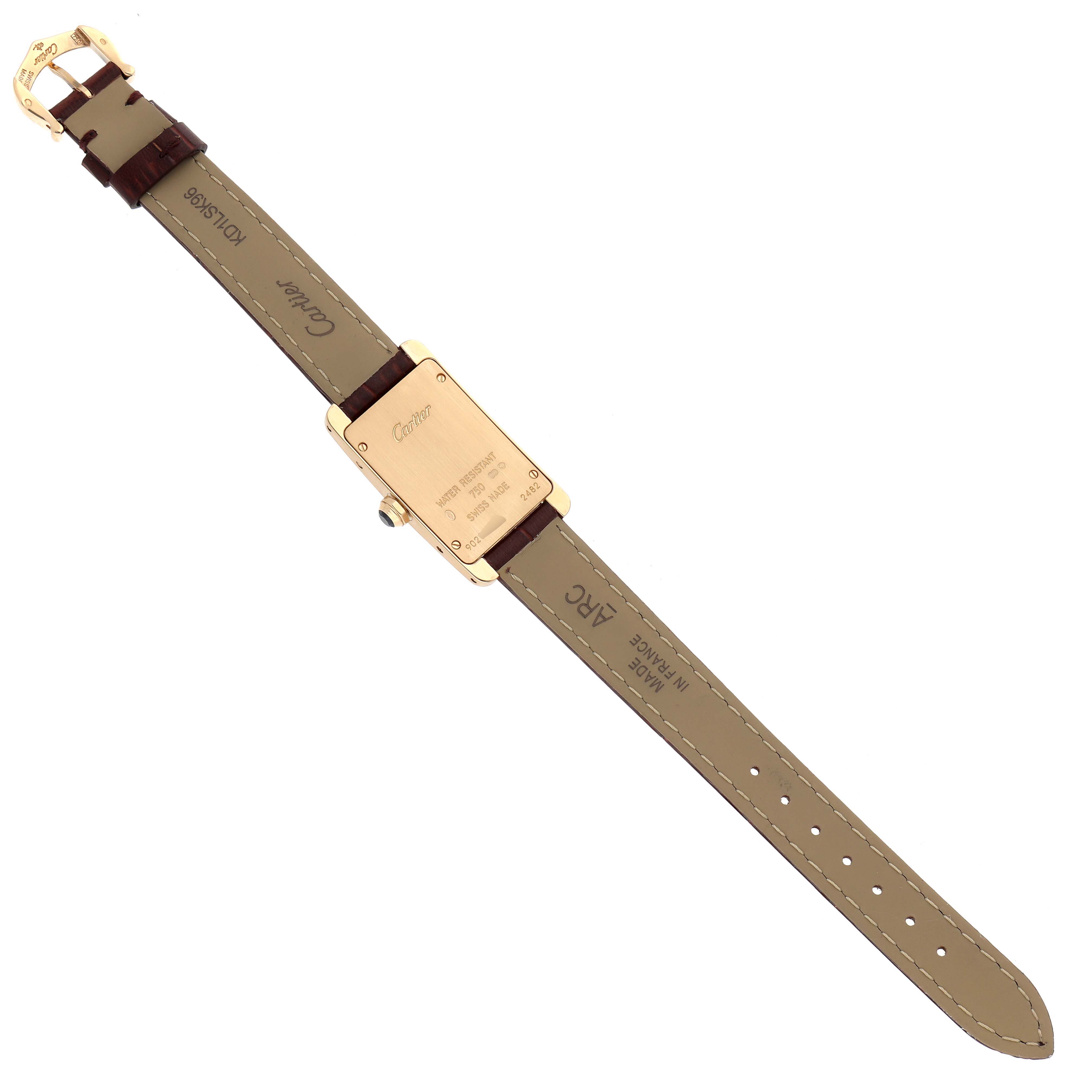 The image shows the back of the Cartier Tank Américaine watch, highlighting the strap, buckle, and case back details.