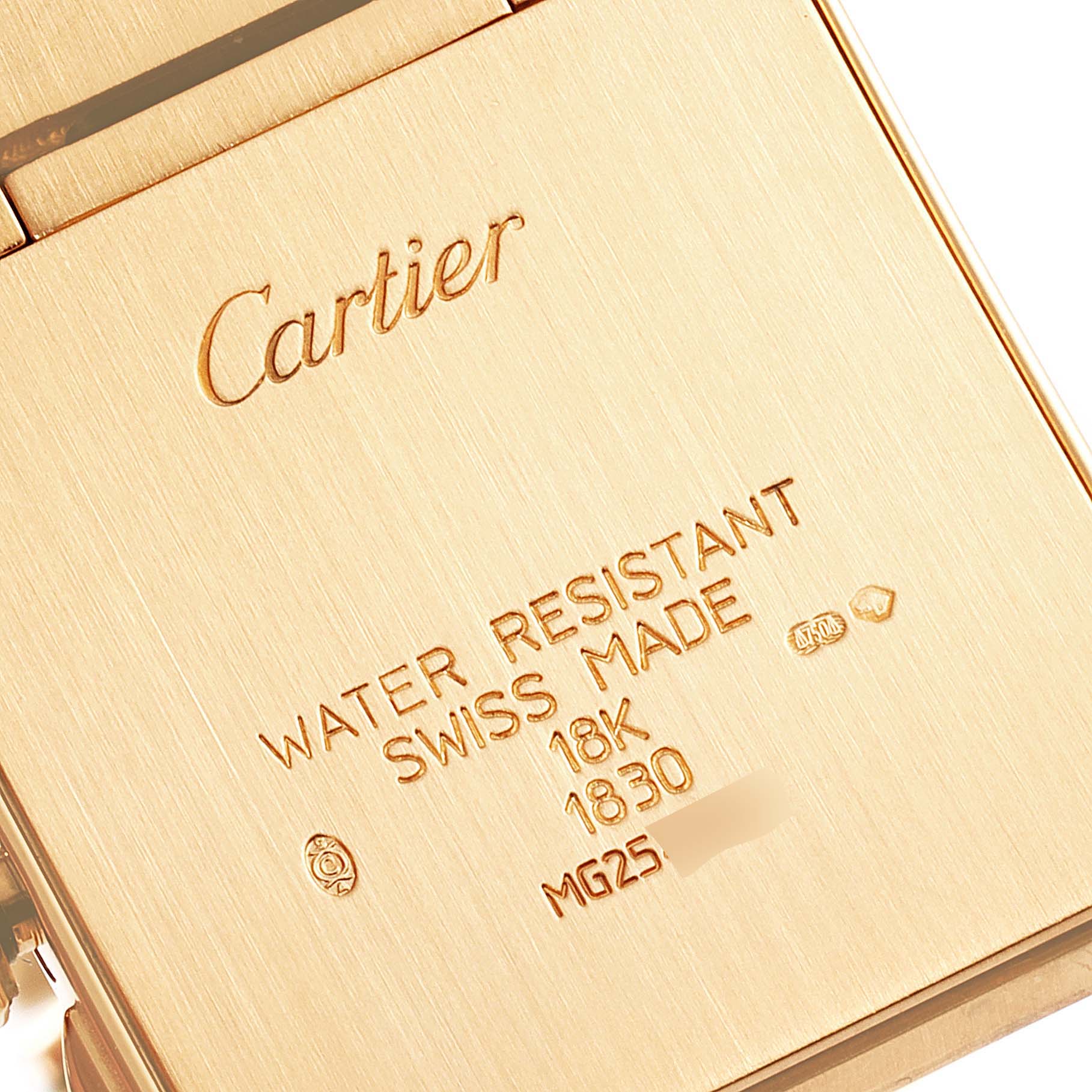 The image shows the engraved back plate of a Cartier Tank Française watch, highlighting its water resistance, material, and origin.