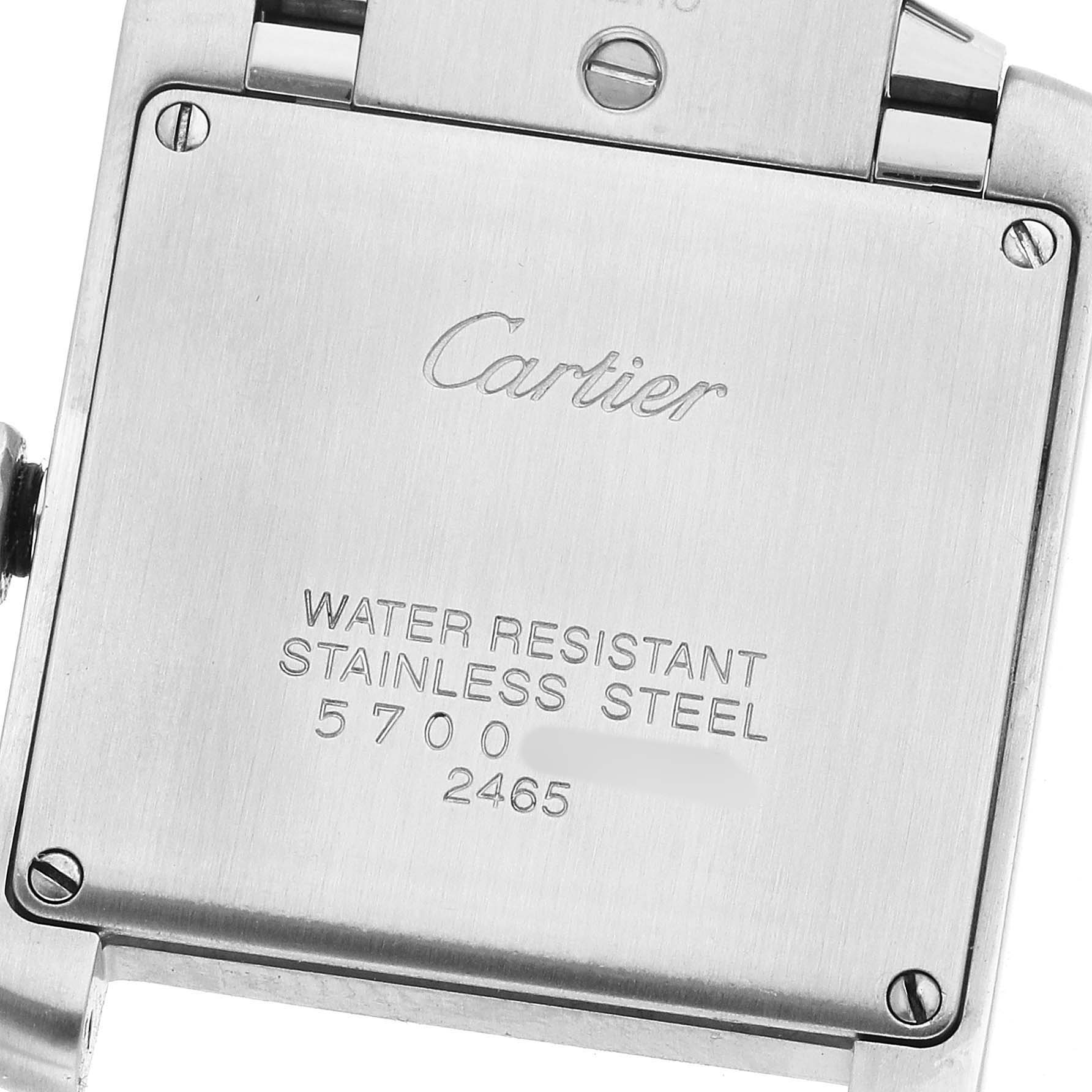 The image shows the back case of a Cartier Tank Francaise W51011Q3 Women's Stainless Steel Beige Dial watch with engravings about water resistance and material.