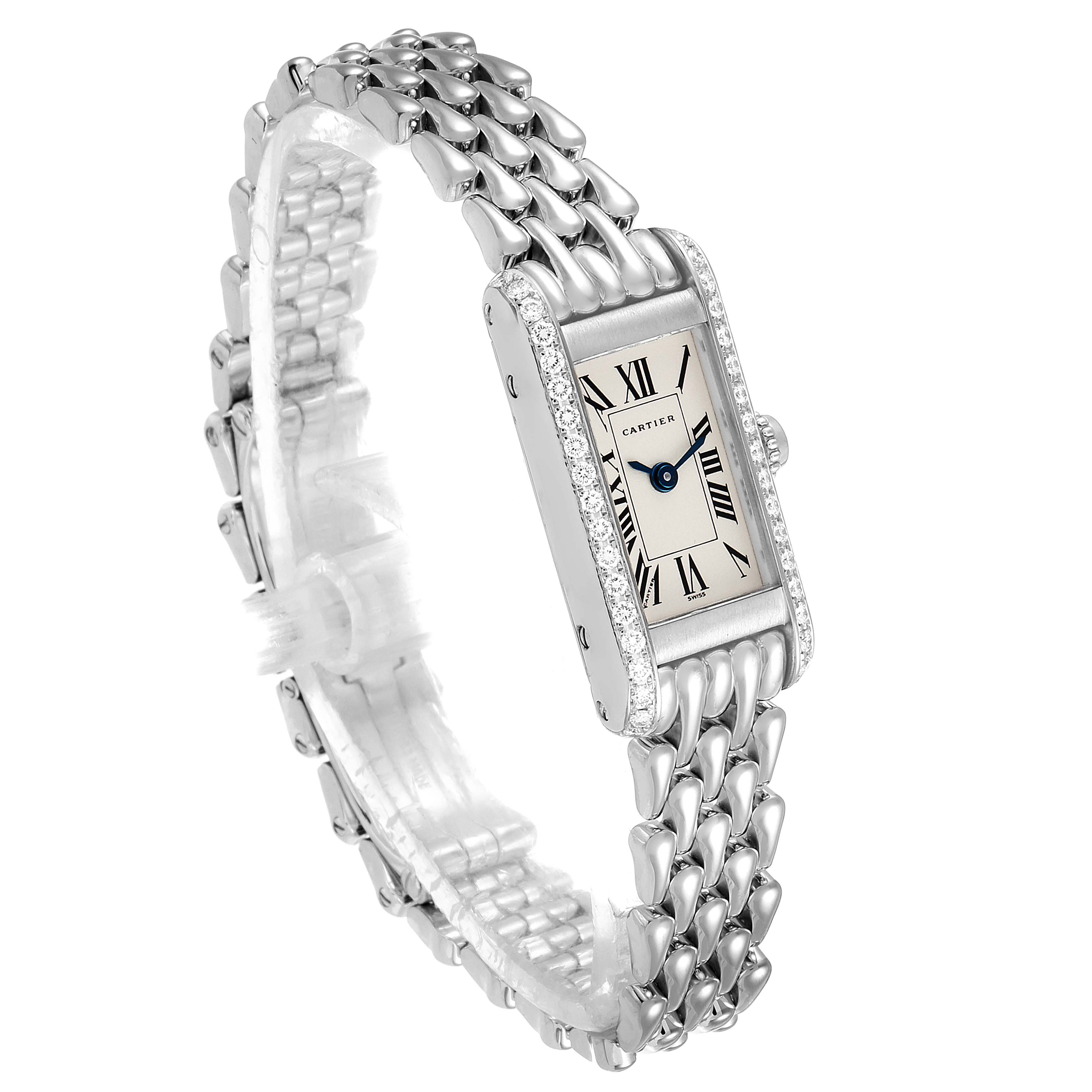 The image shows a Cartier Tank Americaine 1381 Women's White Gold Silver Dial 1381 Women's White Gold Silver Dial watch at an angled view, highlighting its rectangular face, Roman numeral markers, and metal bracelet.