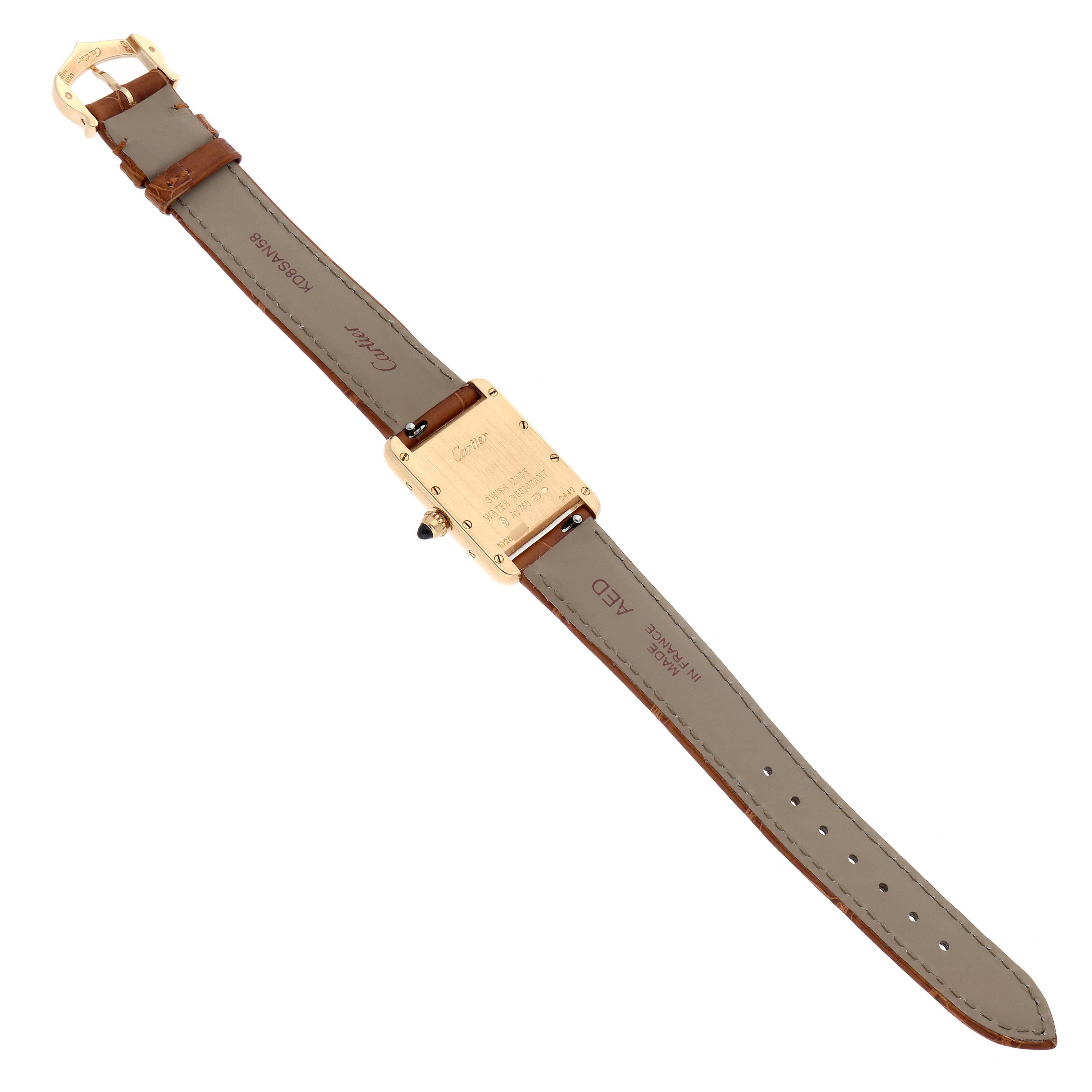 The Cartier Tank Louis W1529856 Women's Yellow Gold Beige Dial watch is shown from the back, highlighting the case back, crown, and full leather strap.